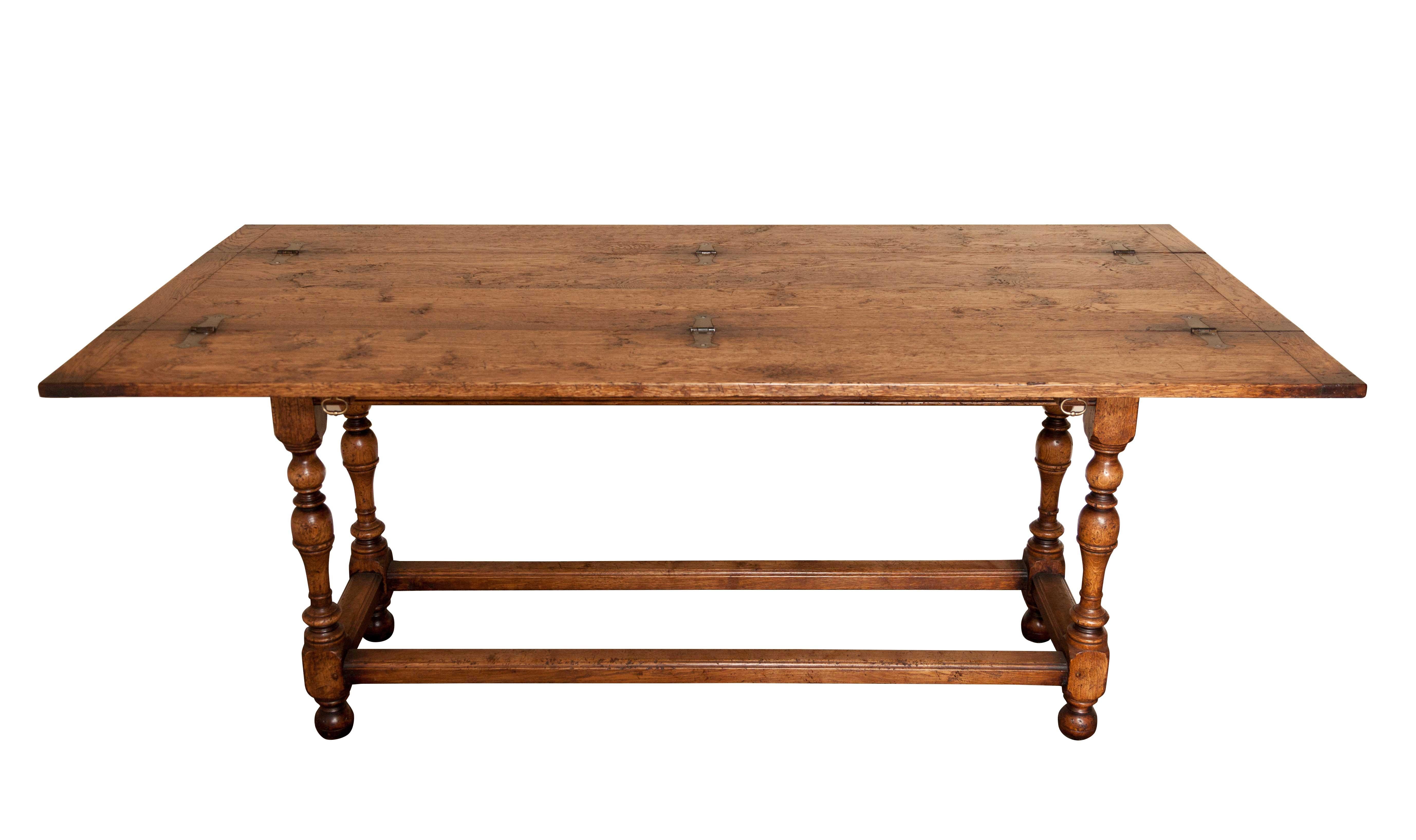 Handmade oak hall or serving table that opens into a dining table.
The fold over leaves open for a good sized dining table with leg room, with the leaves closed a nice side/entrance table.
The table top opens to show rustic hinges.
Made by