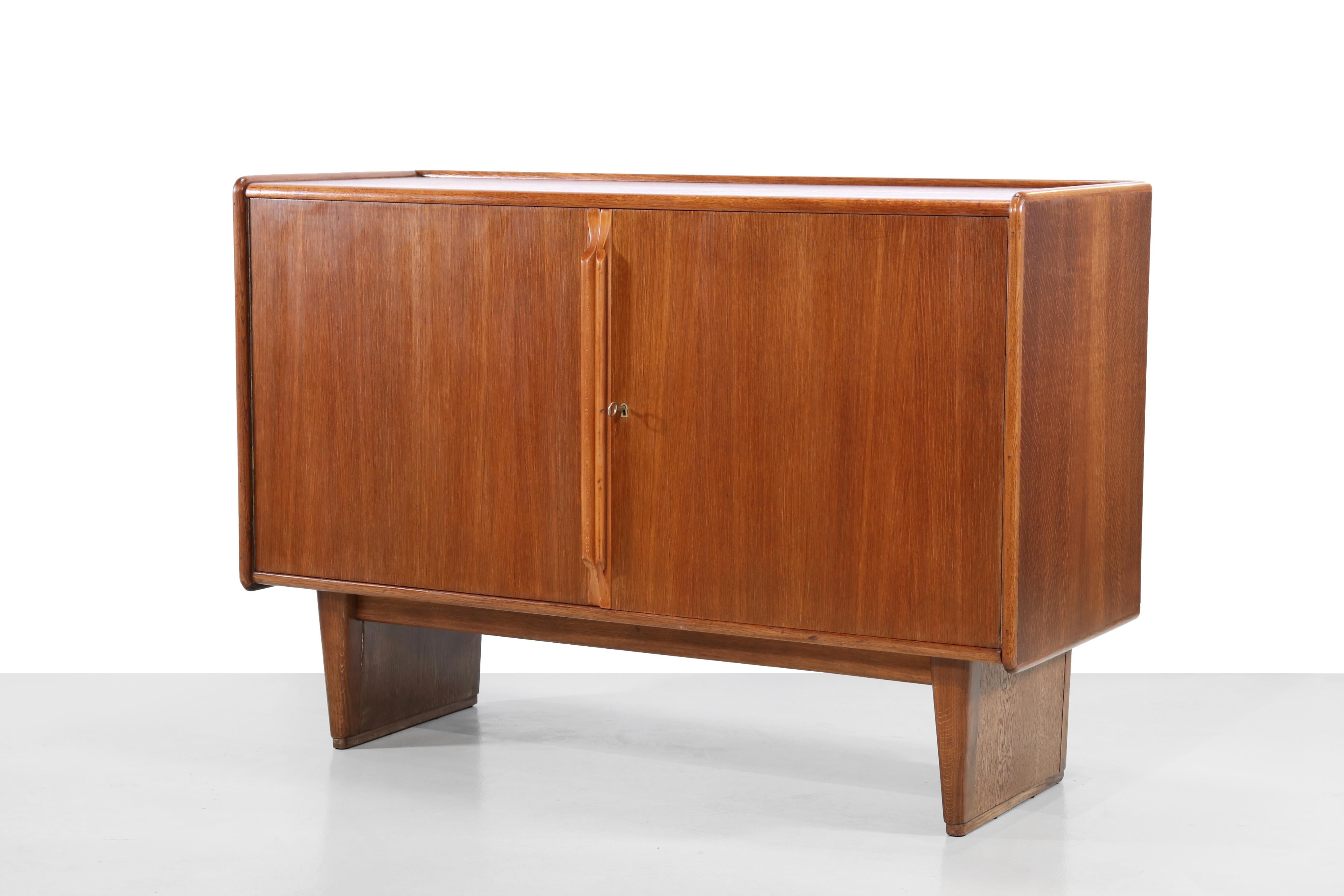 Rare and hard to find model DE01 cabinet by Cees Braakman for Pastoe from the early 1950s, is this model with the two doors. Most likely commissioned as it was at the time. This sideboard from the so-called oak series by Cees Braakman stands on two