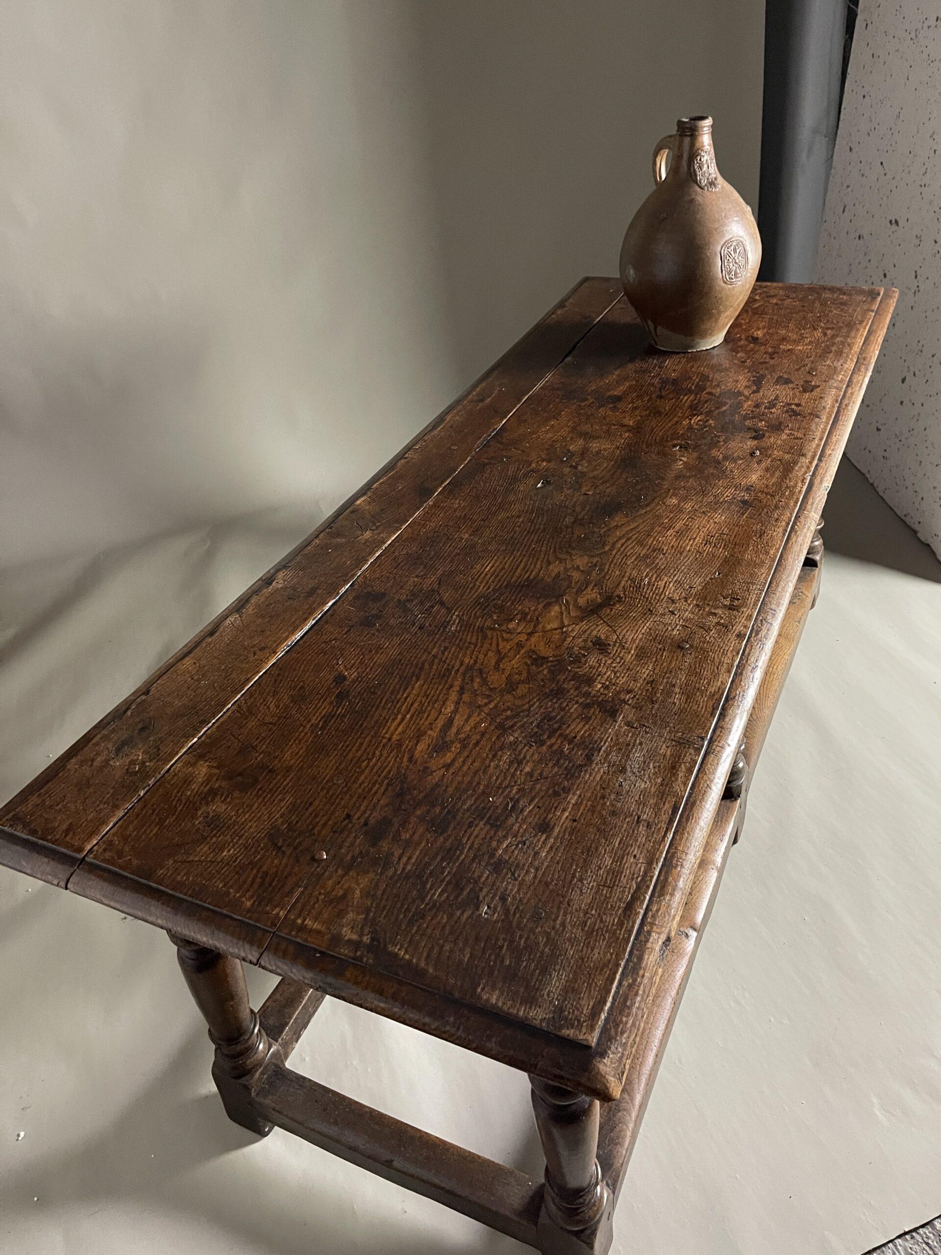 Oak side table c1700 of good colour and surface with 6 turned legs and box starches

size 182cms long 68 wide and 73 high

