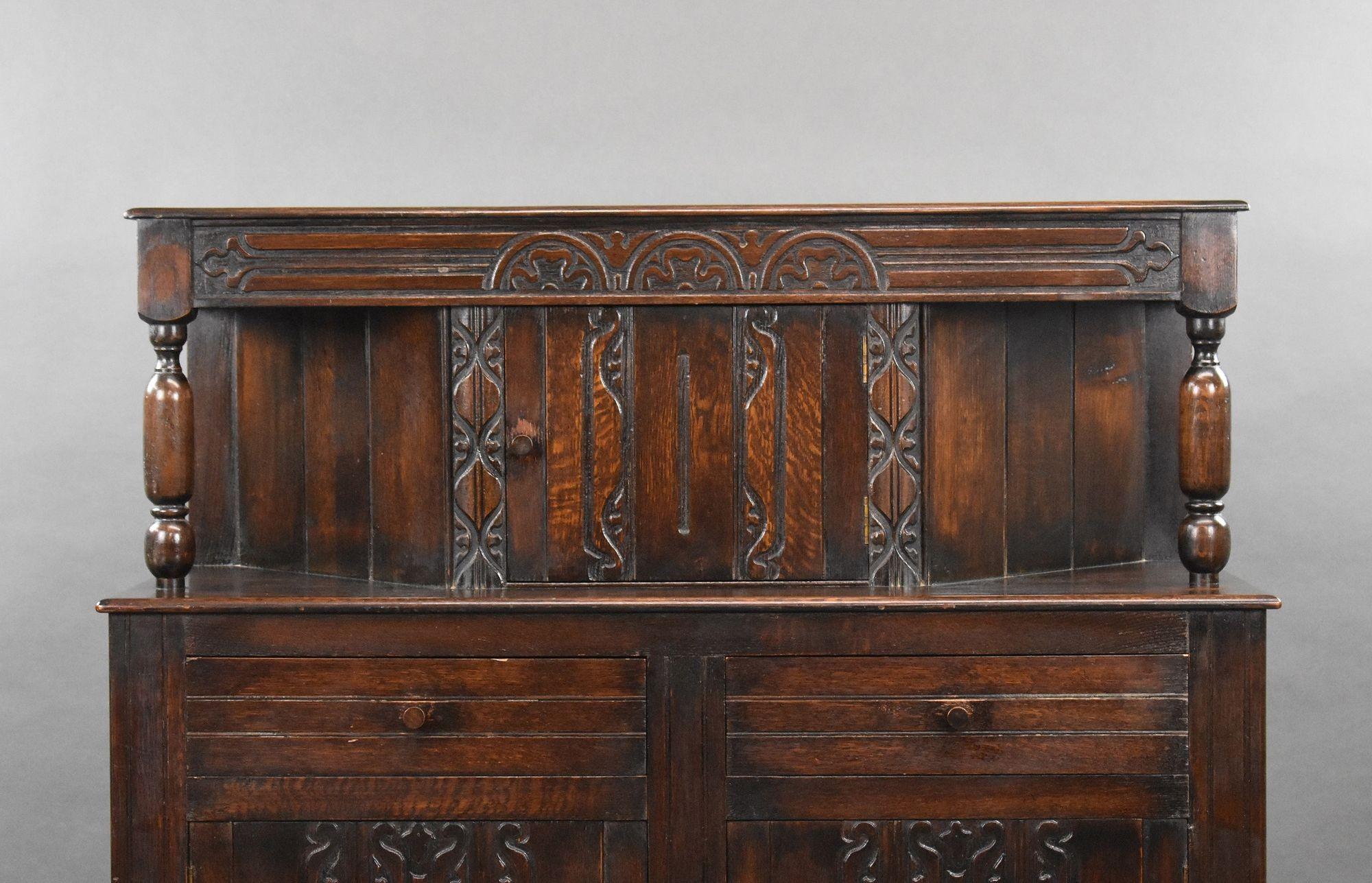 Oak sideboard is a nice addition to any room. With a raised panel door style and hinged door mechanism, it features three doors and two drawers, providing ample storage space.
This sideboard is sturdy and durable, making it perfect for everyday use.
