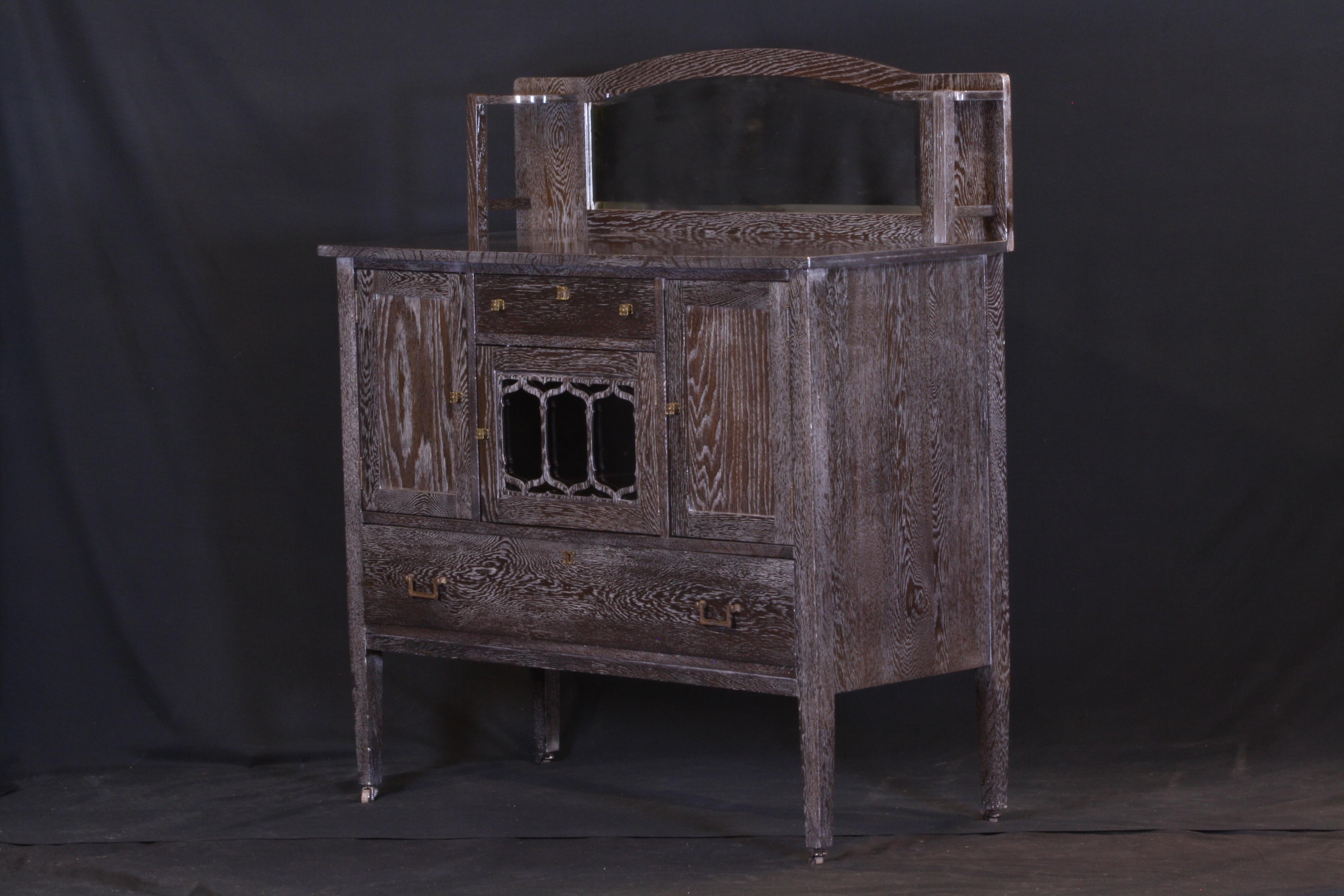 An early 20th century oak sideboard with bevel glass mirror, refinished in a slate grey satin with a gloss lacquer.