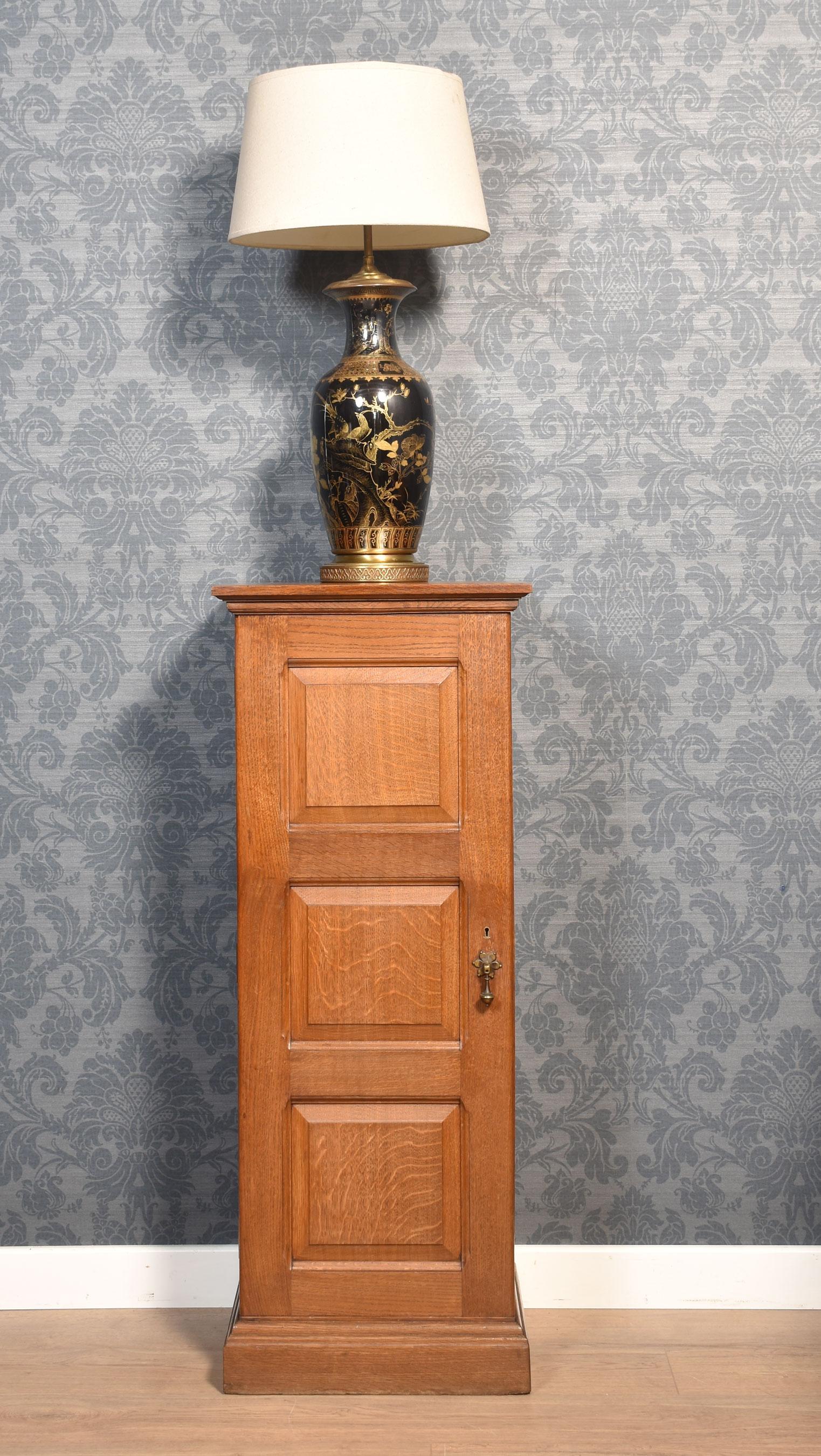 Solid oak filing cabinet the square top with moulded edge above a panelled door opening to reveal nine drawers. All raised up on a plinth base.
Dimensions
Height 45.5 Inches
Width 18 Inches
Depth 16 Inches