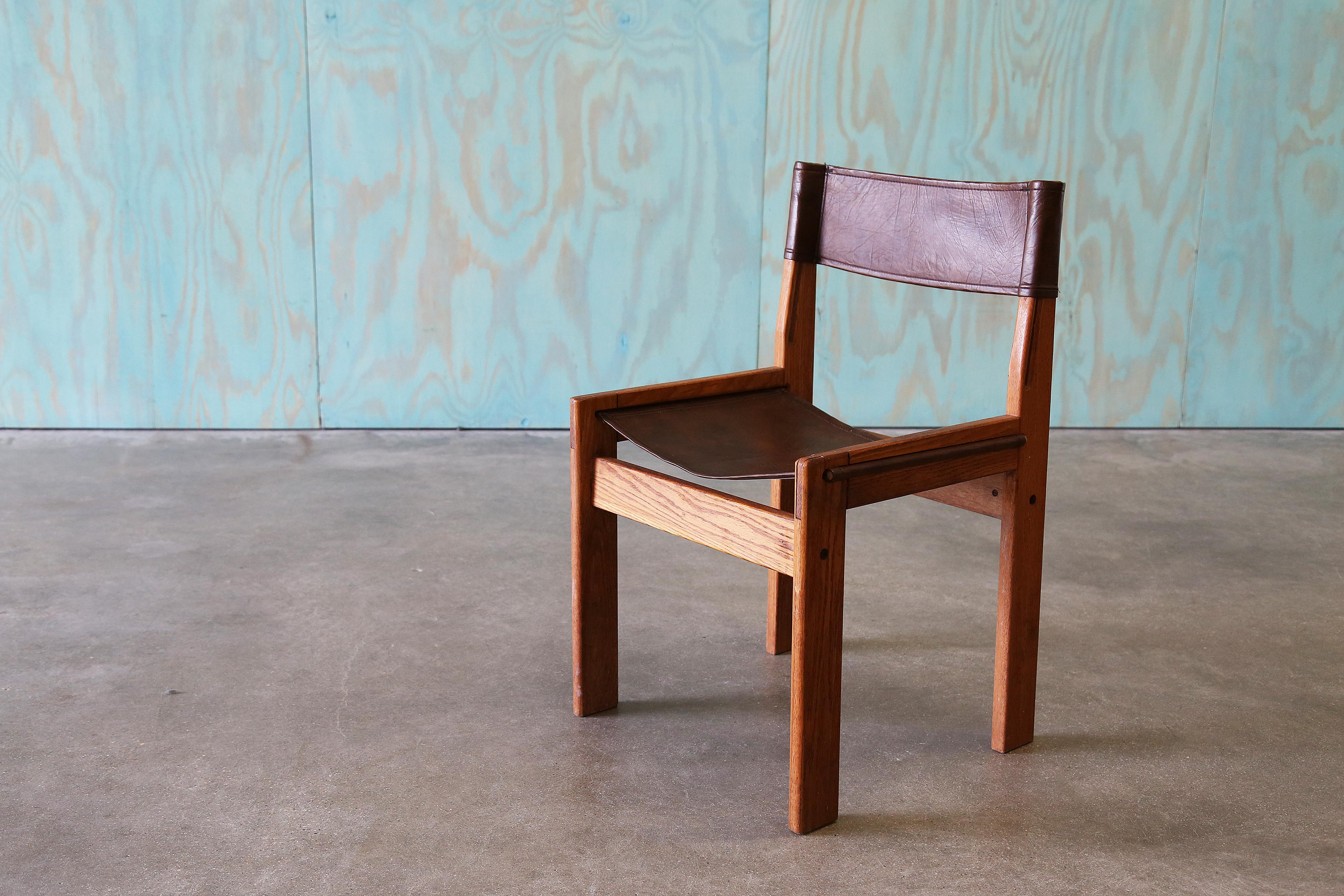 A great chair in solid oak and a heavy vinyl sling in the style of Michel Arnoult. beautiful lines a dowel rods hold the seat seat.  Can be used as a desk, dining or occasional chair in a bedroom.  

Unsigned.

Dimensions: 20.25” Wide 32.5” High 19”