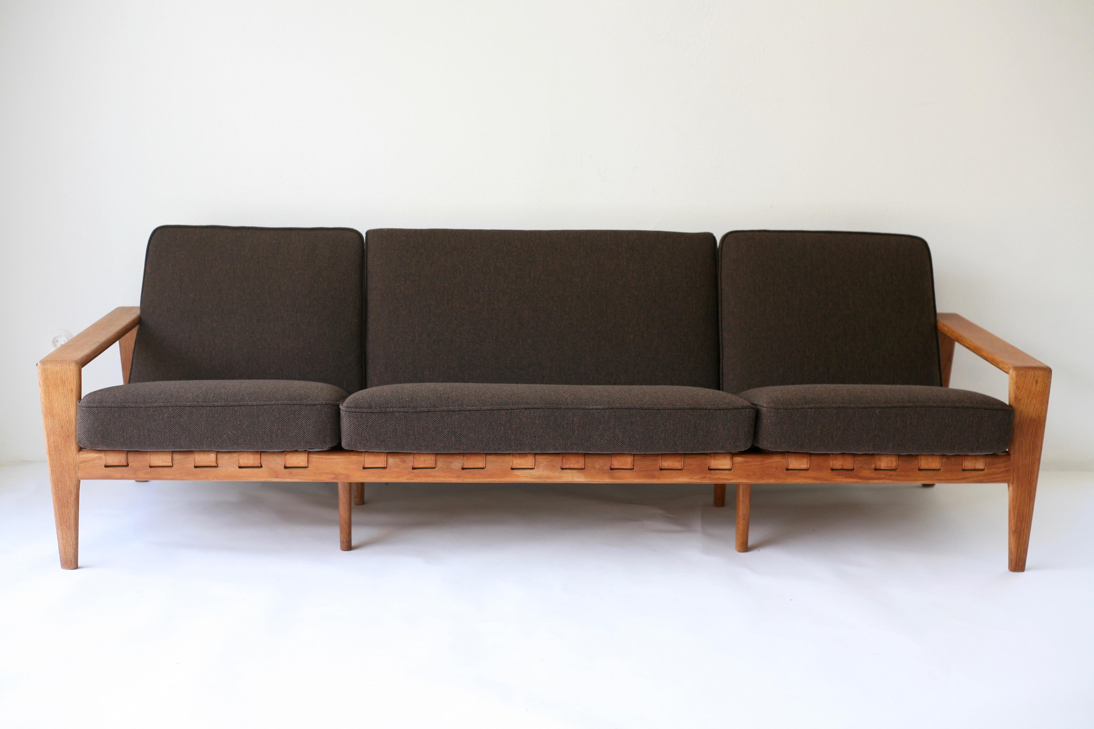 Cool sofa “Bodö” in oak with leather webbing. Brutal design done in 1957 by Svante Skogh for Säffle möbler. This sofa manufactured by Bodafors. Due to tye length of the sofa it has four supportive legs underneath, two to the front and two to the