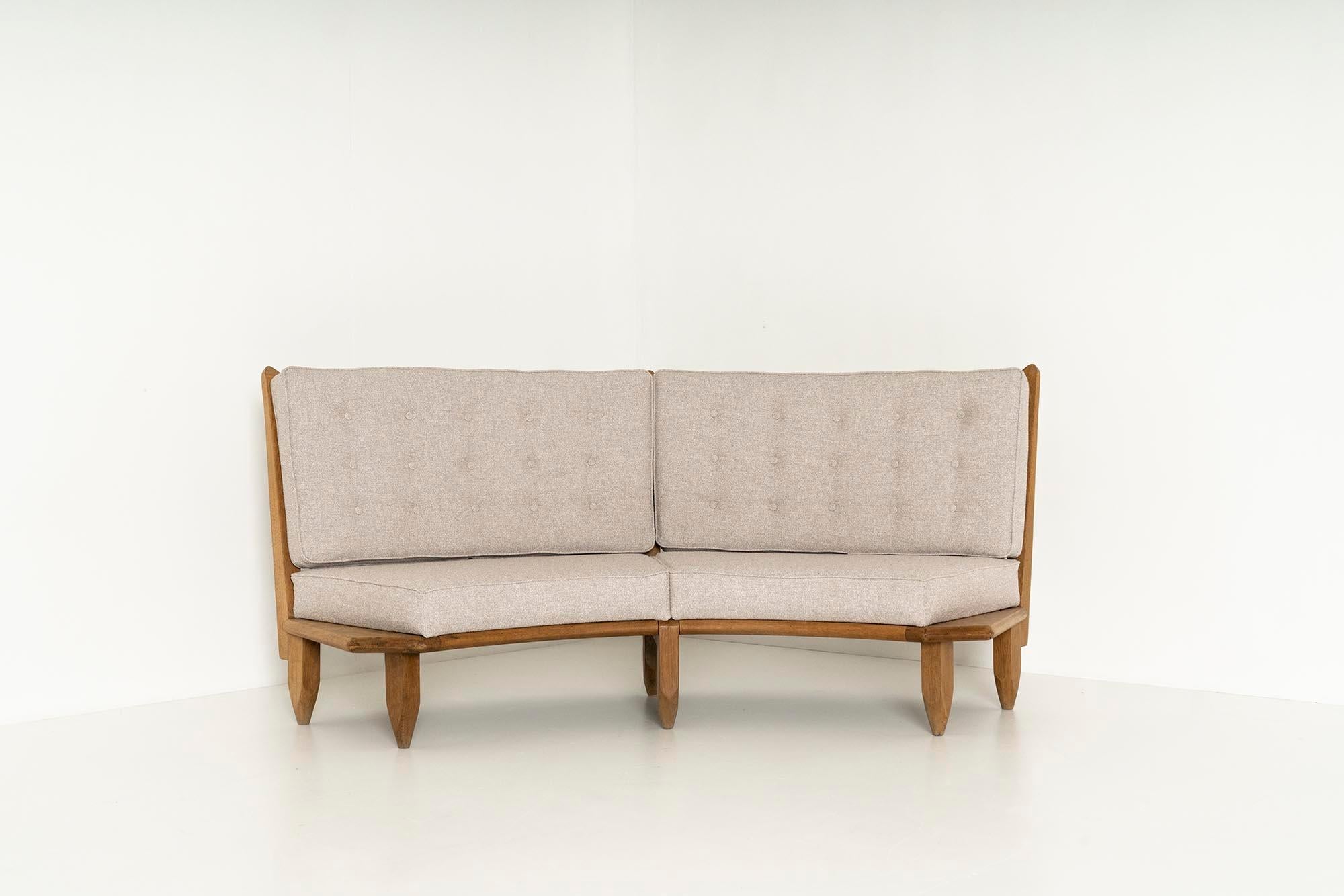 Amazing French half round sofa by the famous duo Guillerme et Chambron from the 1960s. Guillerme et Chambron represent a significant moment in French mid-century design history. The frame of the sofa is slightly rounded and made of oak wood. The