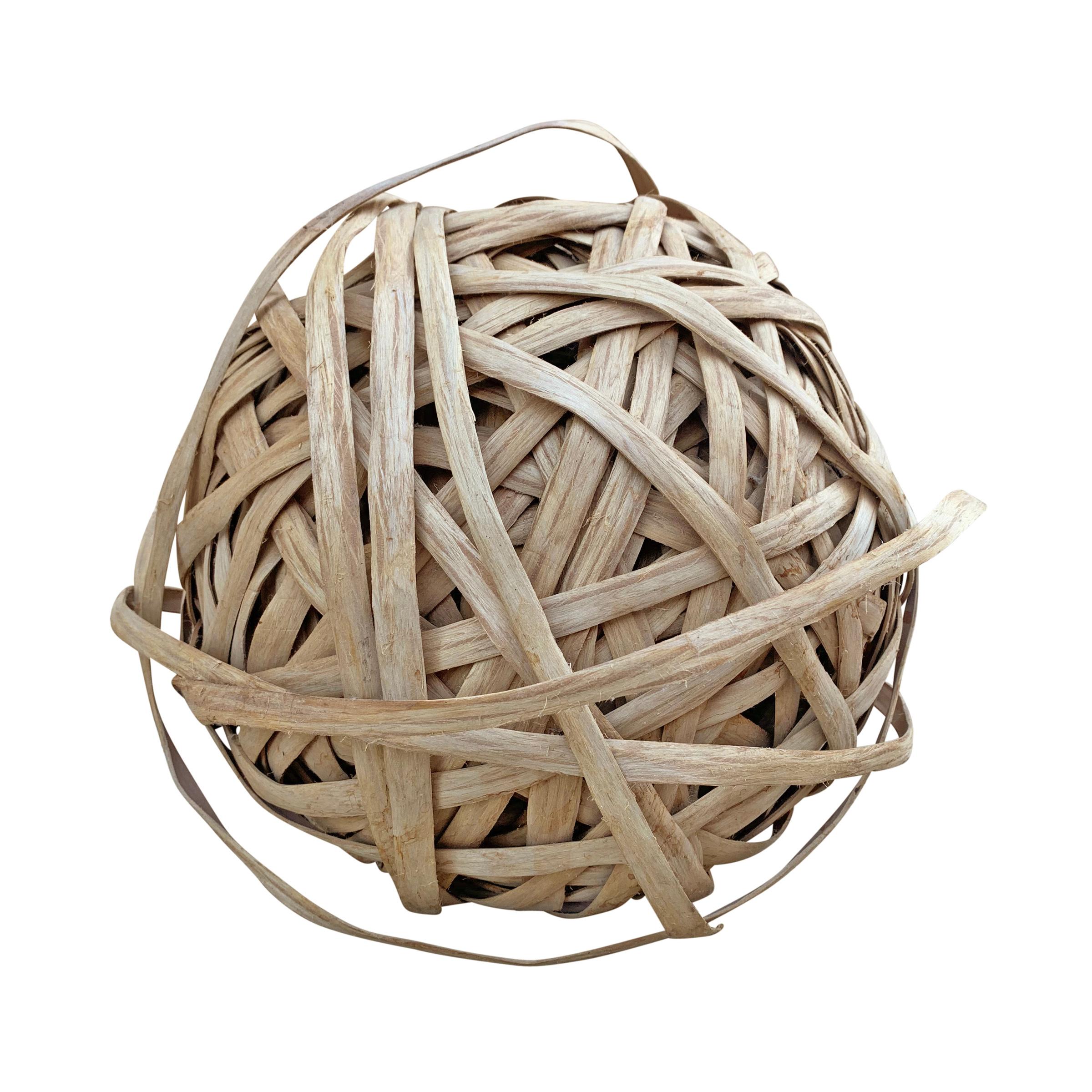 A wildly sculptural sphere made from oak splints used for making baskets. Acquired from a woman who made baskets, the splints have been woven into a sphere, possibly for storage purposes, but possibly on purpose to create a sculpture. Your guess is