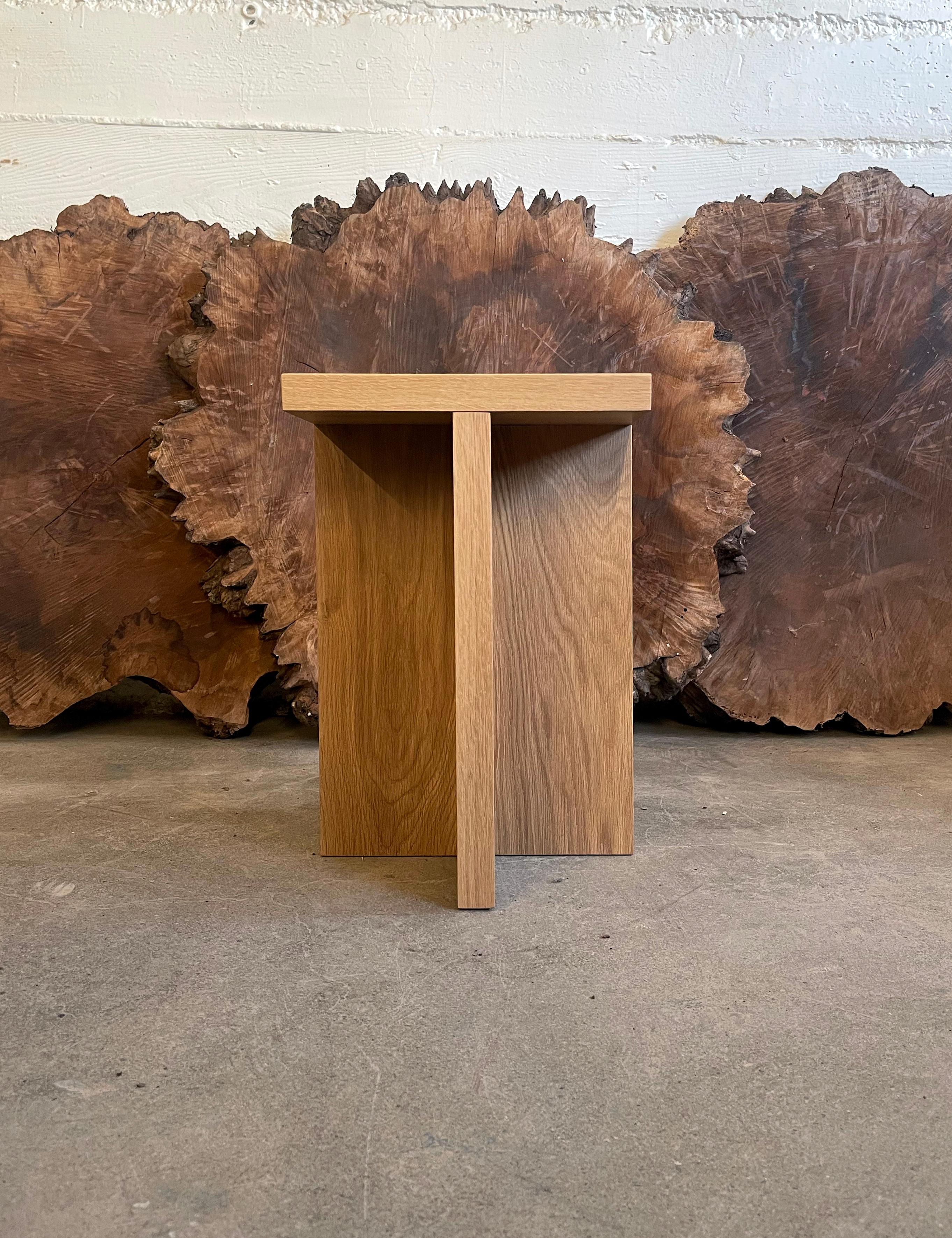 Solid wood stool / side table in white oak with square top. With a clean and minimal design, these stools are handmade in Portland, Oregon with mortise and tenon joinery in Material's workshop. Also available with a square top, in a number of wood