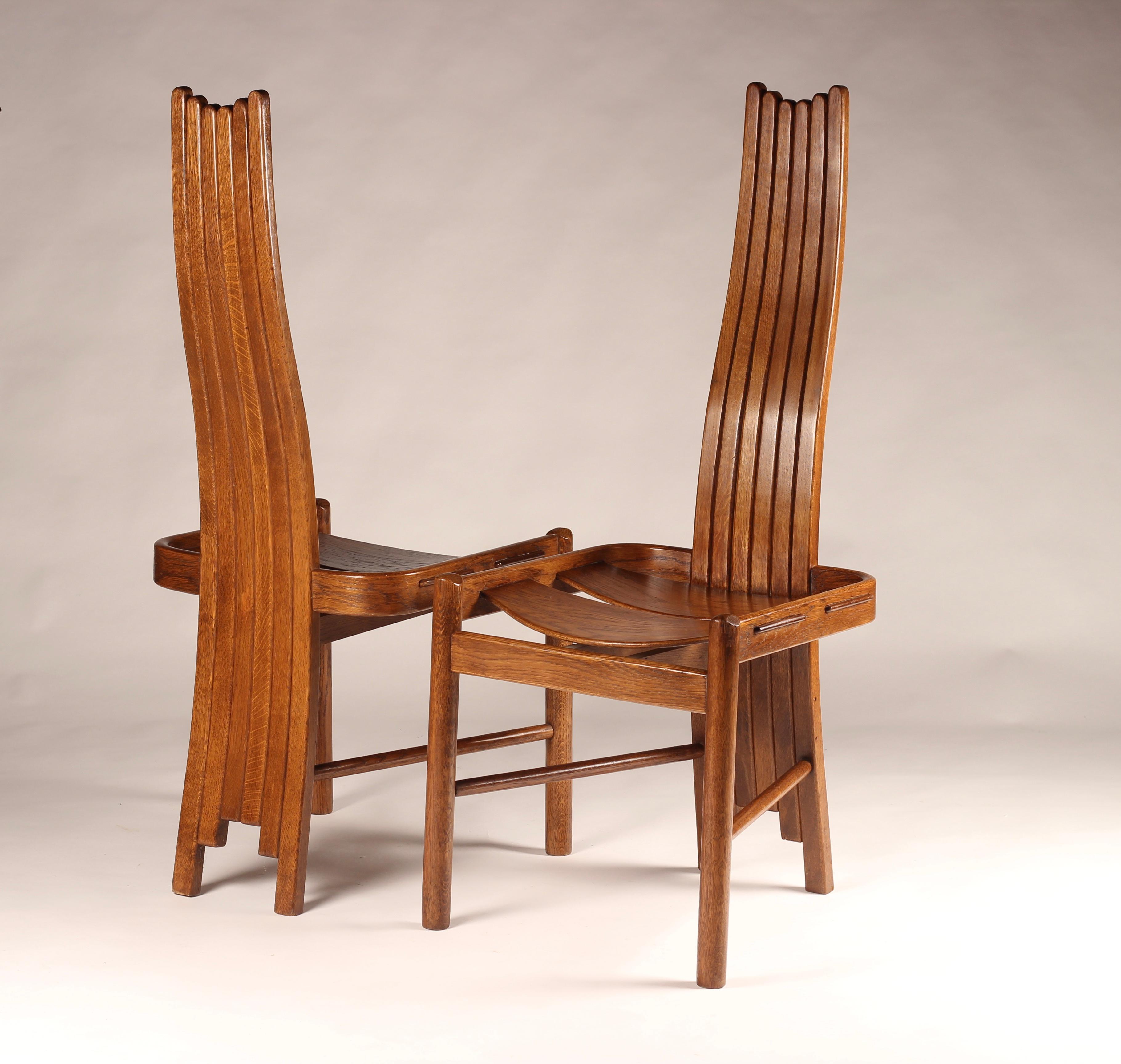 A beautifully crafted and very interesting set of four Oak Dining Chairs or side chairs in the manner of Charles Rennie Mackintosh. Straddling the styles around the early 20th Century these chairs show signs of the Arts & Crafts movement, Symbolism,