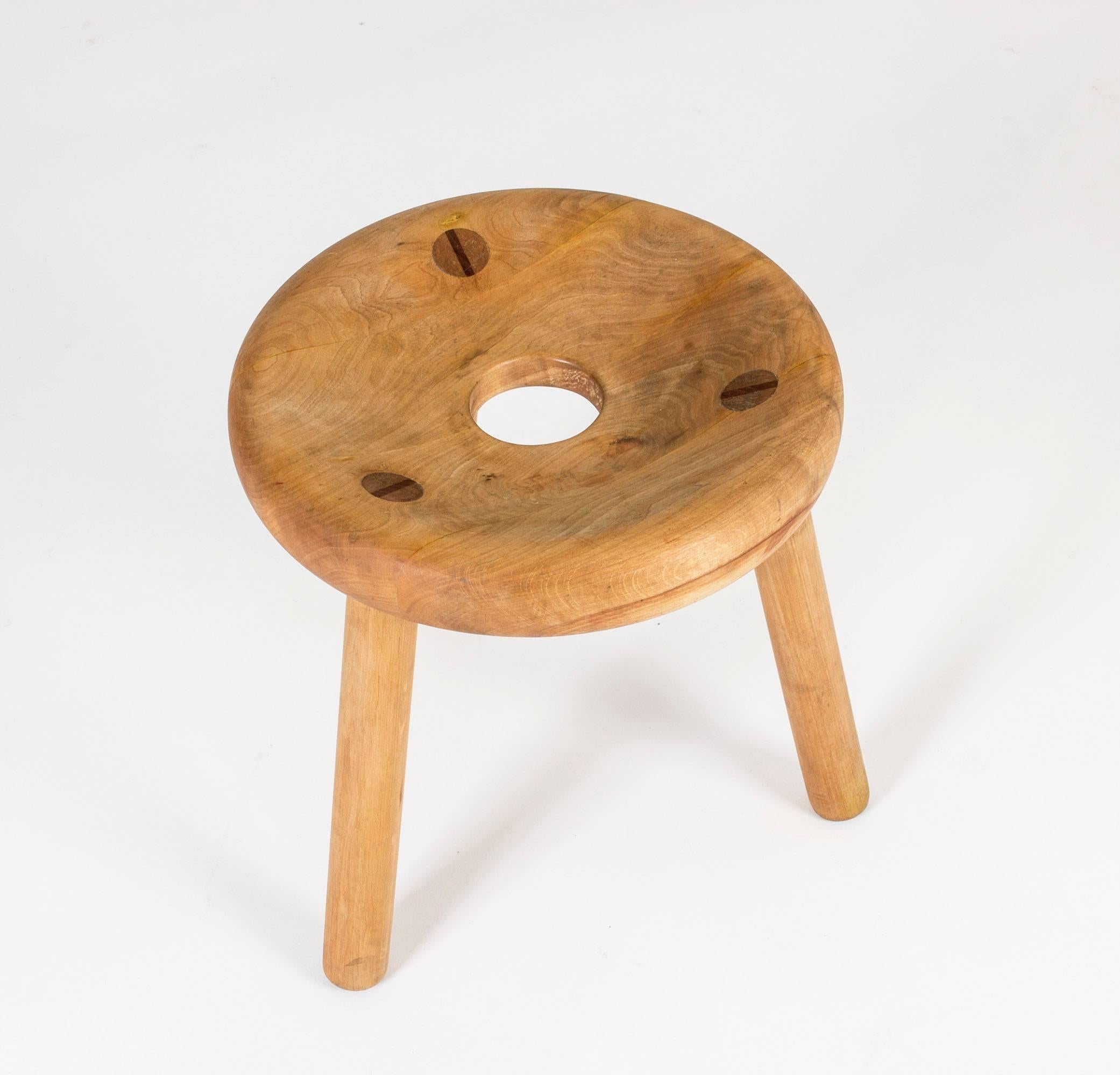 Oak sauna stool by Bertel Gardberg with a hole in the middle and contrasting color wooden plugs. Very appealing, plump design and nice patina.