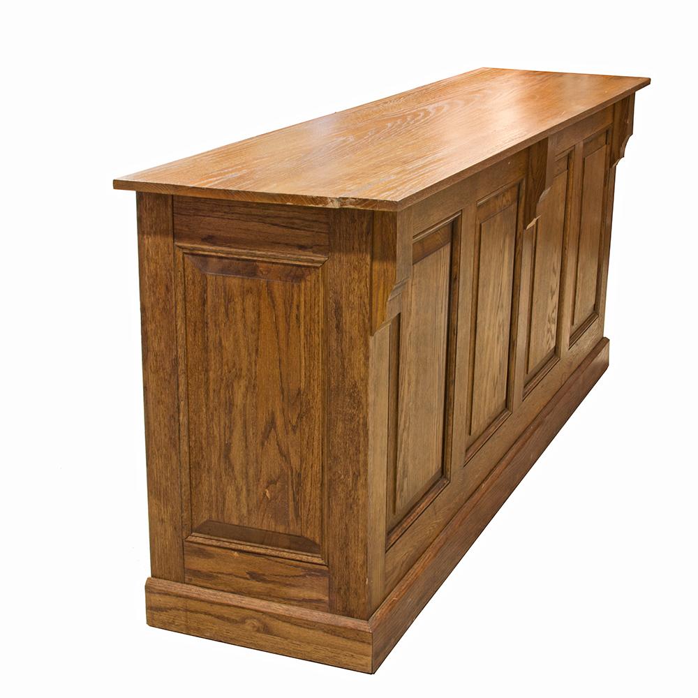 This gorgeous oak counter is made of reclaimed oak and has a beautiful high gloss finish. Restrained accents in the form of corbels and recessed panels make this a fine piece for retail or home.