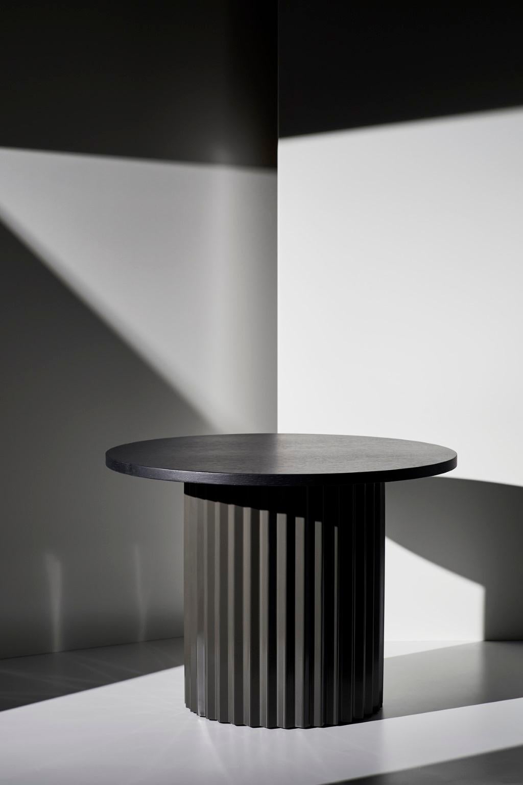 Oak table 60 by Lisette Rützou
Dimensions: D 60 x H 41 cm
Materials: Oak tabletop 
Also available Ø 40.

 Lisette Rützou’s design is motivated by an urge to articulate a story. Inspired by the beauty of materials, form and architecture, each
