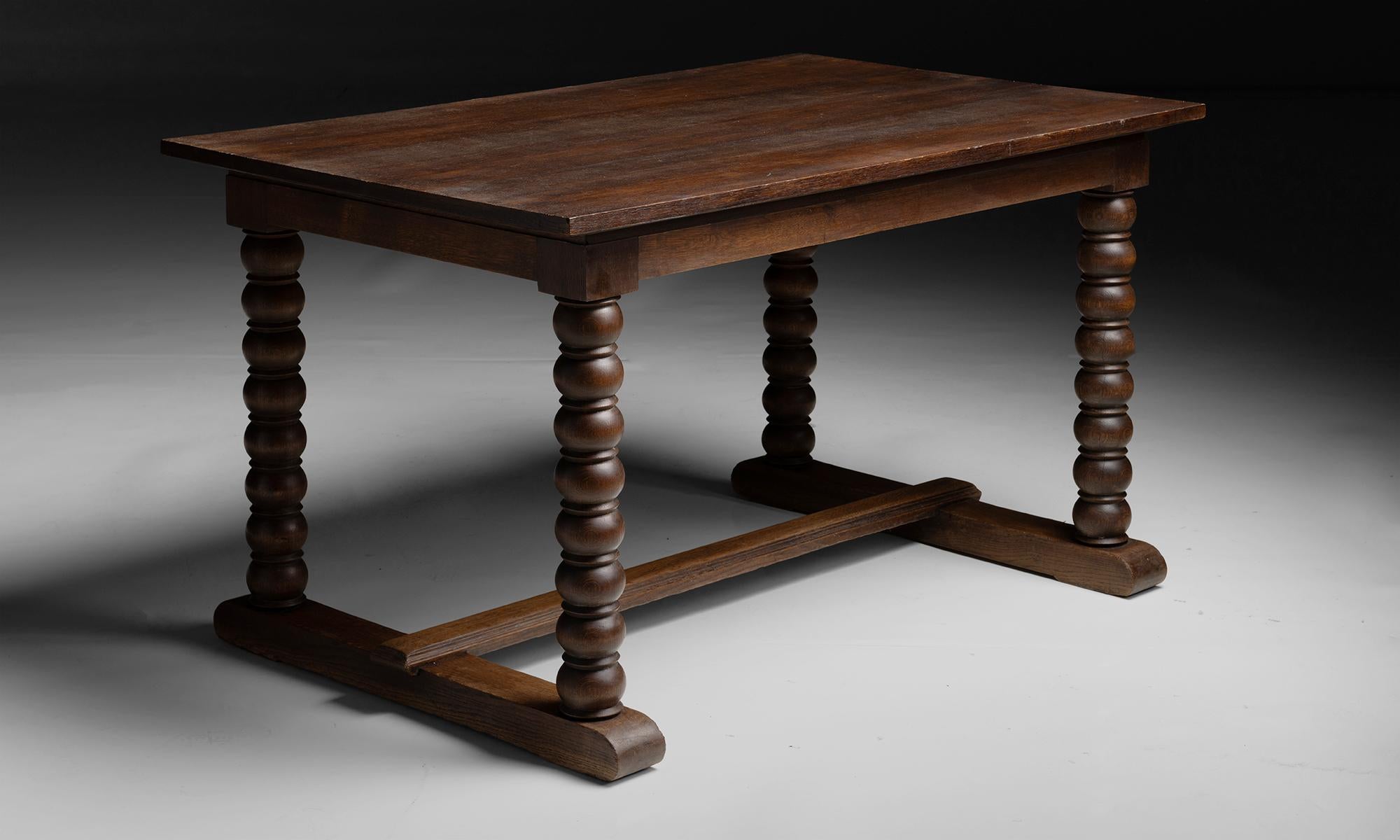Oak Table / Desk

France circa 1940

Oak table with turned wood base.

53.25”L x 33.5”d x 30.25”h
