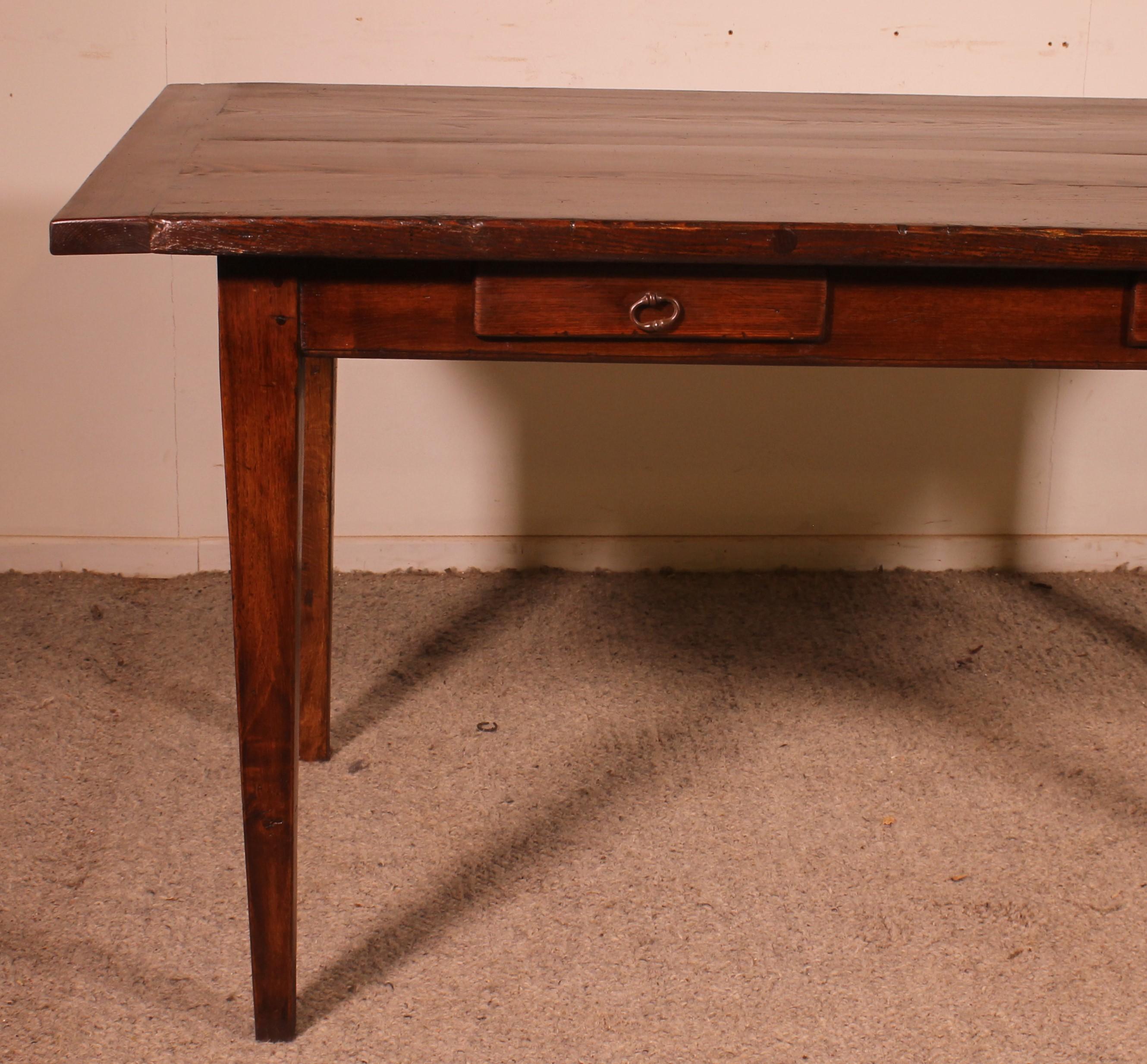 Lovely 19th century farmhouse table in oak and chestnut from France.

Very beautiful table with two drawers in the belt that can be used as a dining room table or desk.

Very beautiful top with a superb patina and a nice thickness which is