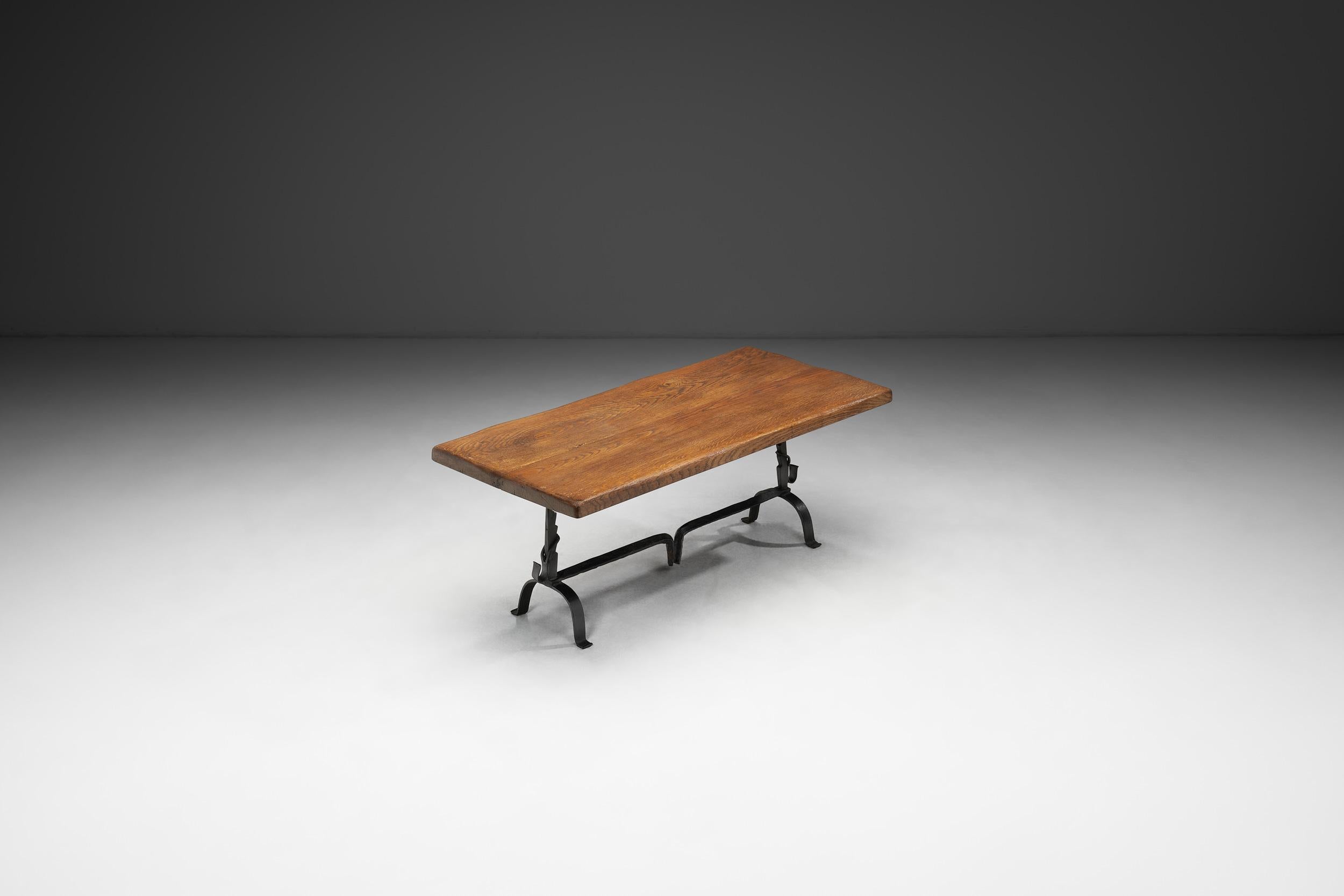 Crafted in the manner of Jean Touret and the artisans of Marolles, this table is a timeless example of the beautiful pieces that were produced in France in the mid-20th century. There are some common elements that define not only French, but