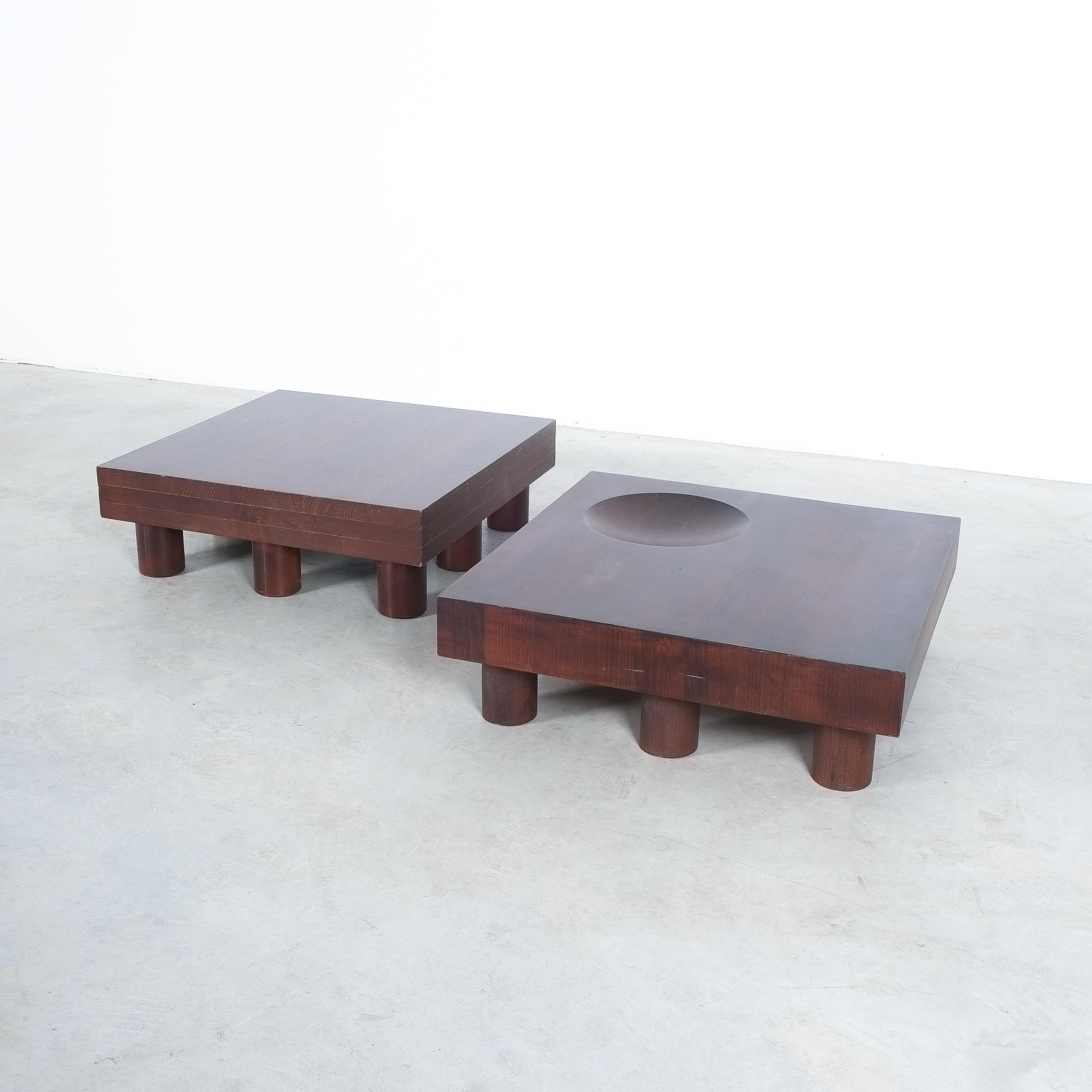 Solid pair of oak tables, circa 1970

Beautiful pair of low side tables or coffee tables. Handcrafted small tables made from solid oak wood glazed in dark cherrywood red. One has got a massive butcher-top. The other one a sunken bowl or catch-all.