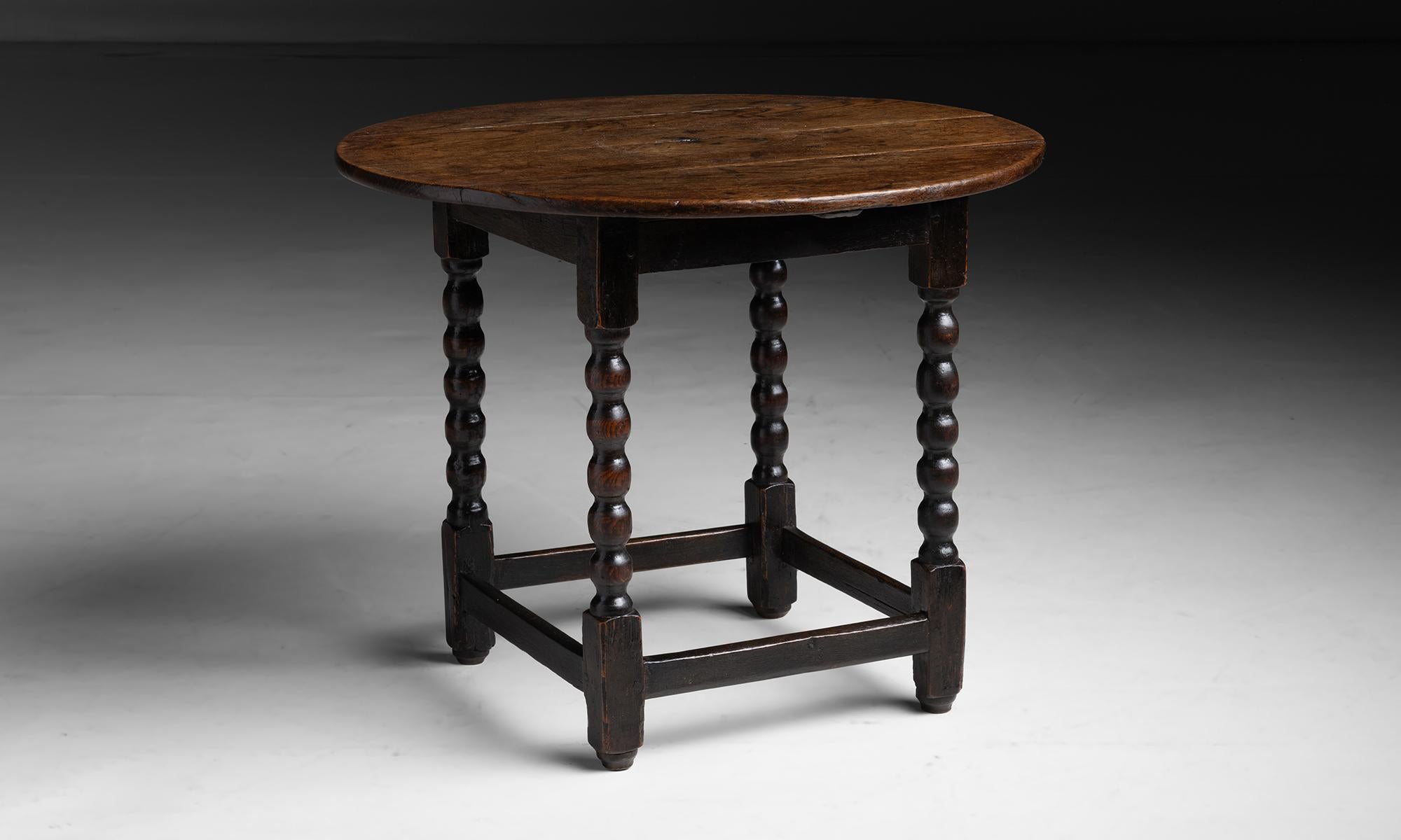 Oak Tavern Side Table

England circa 1790

Circular top with bobbin turned legs, constructed in oak.

Measures 29.75”dia x 24”h
