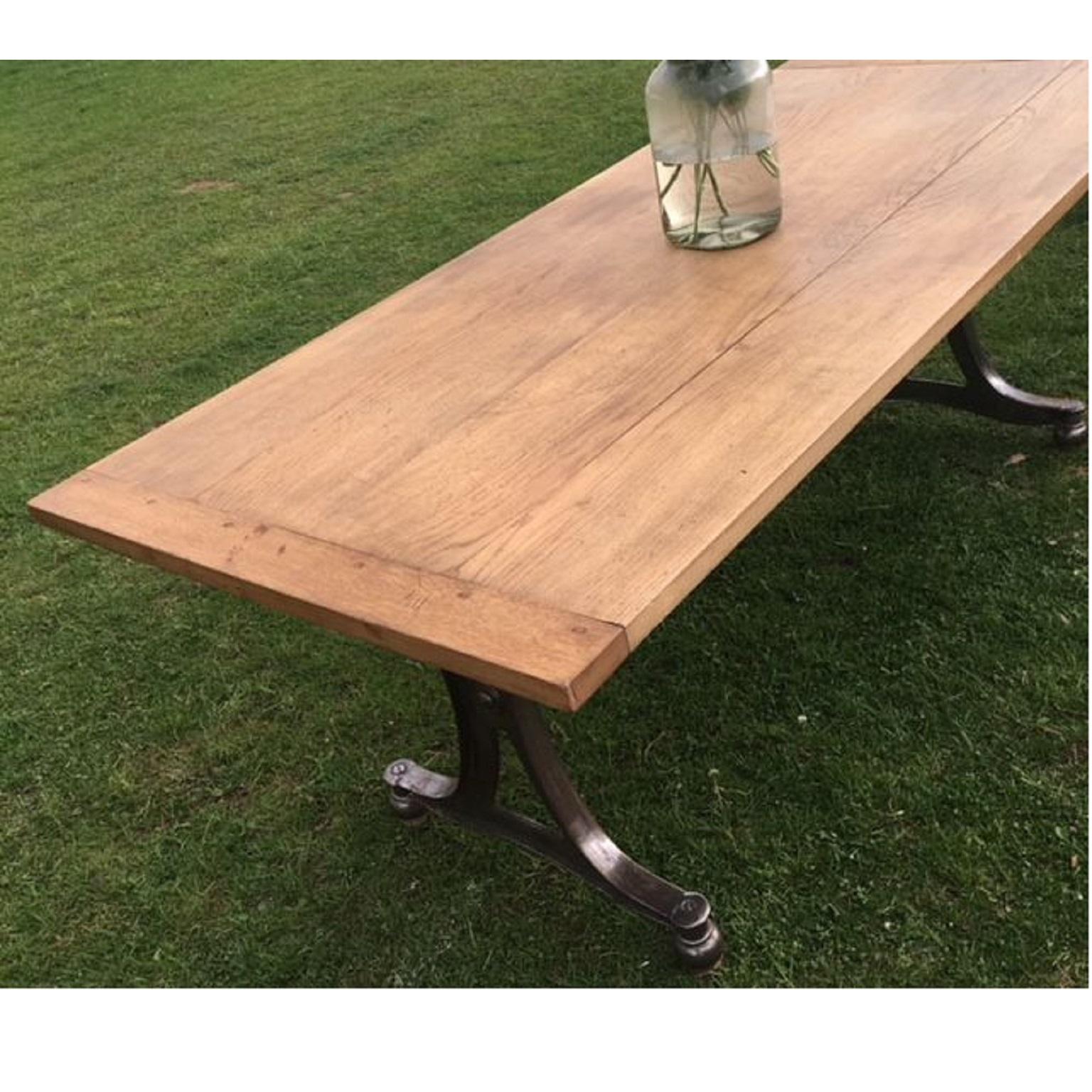 Oak top dining table with Industrial vintage cast iron legs. Reclaimed rustic style slightly distressed oak top (see images). On fabulous original Industrial legs, circa early 20th century, that have been stripped and polished.
This is a stunning