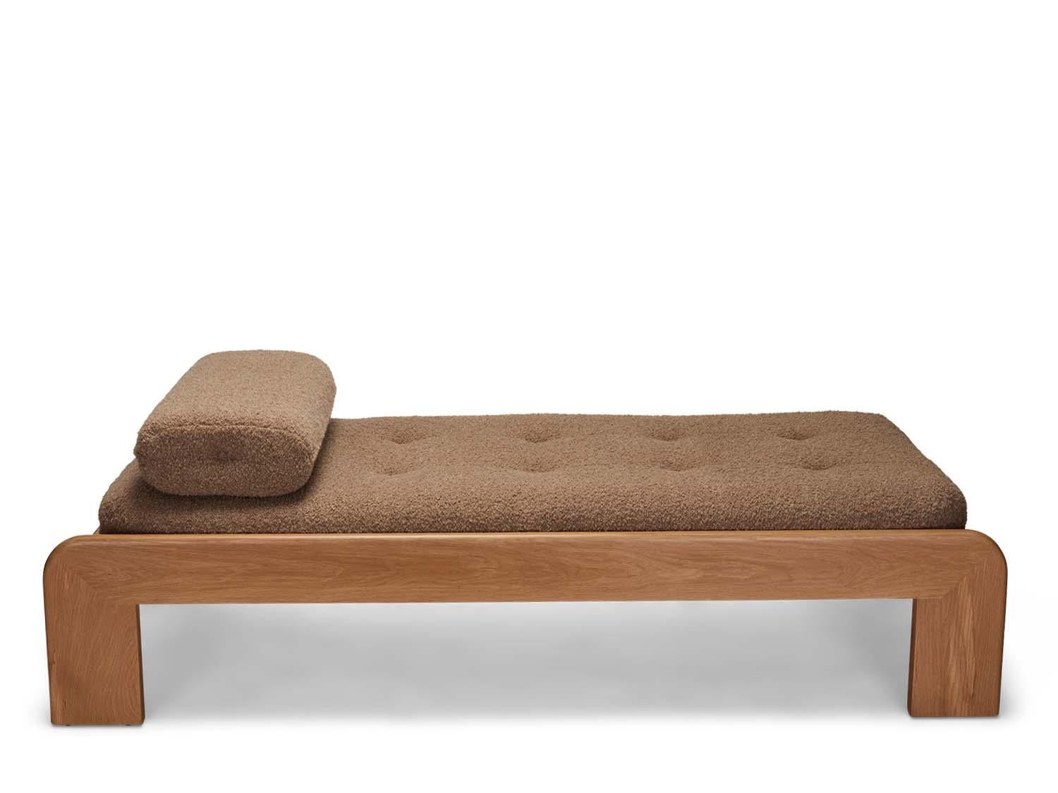 Oak topa daybed by Lawson-Fenning. The Topa daybed features a round over frame handcrafted in American walnut or white oak. The daybed is tufted and comes with a loose bolster pillow. 

 The Lawson-Fenning Collection is designed and handmade in