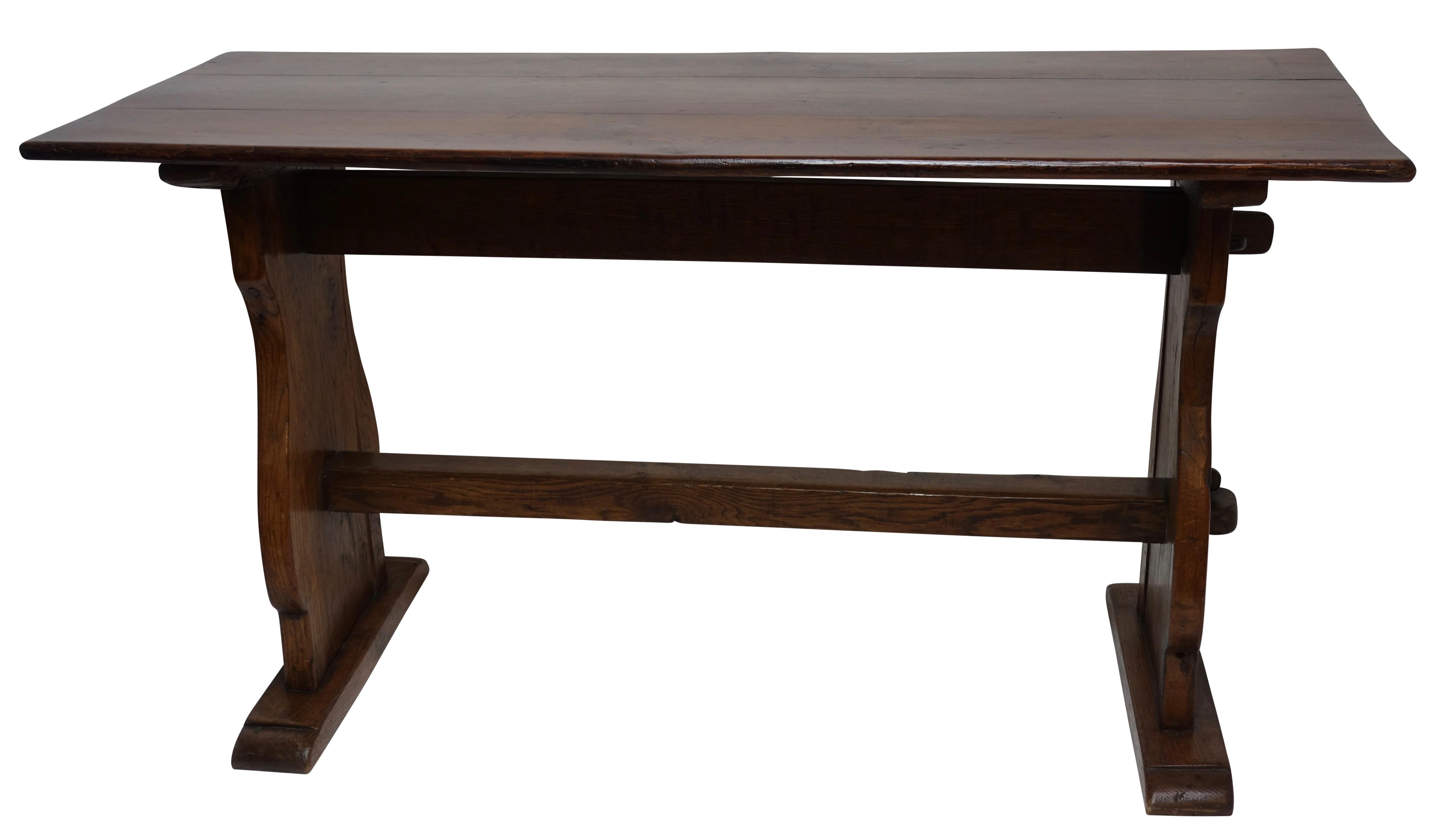 Dutch Oak trestle table, with a double stretcher connecting the baluster shaper supports.  Beautiful warm oak color with a wonderful patch repair on the top corner.  Late 18th. Century.
