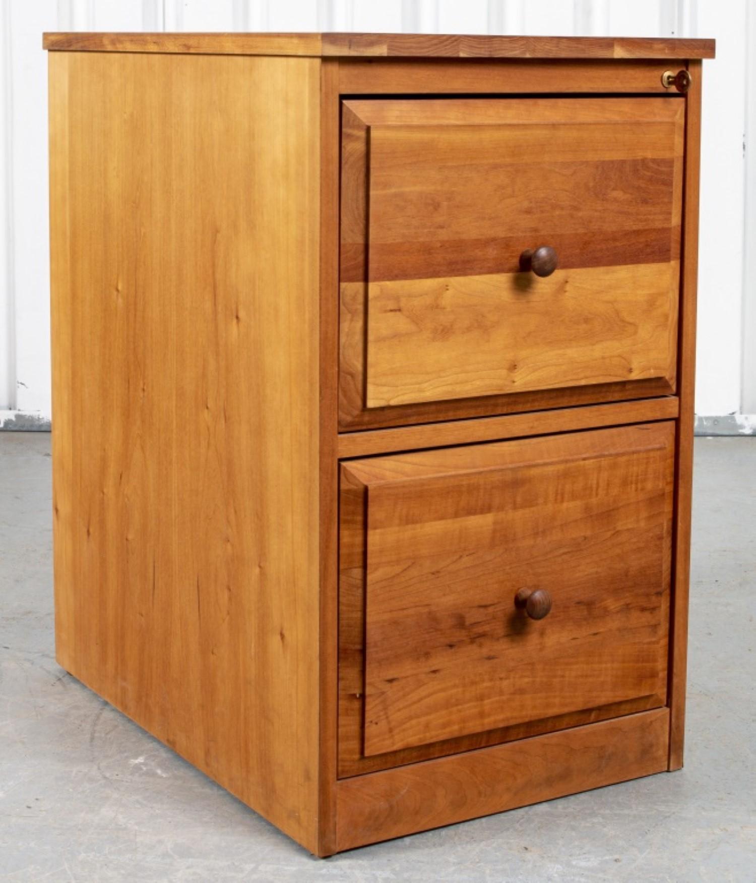 his vintage oak two drawer file cabinet is a stylish and functional storage solution for your home or office. It features two spacious drawers with metal pulls, perfect for storing important documents and files. The cabinet is made of solid oak wood