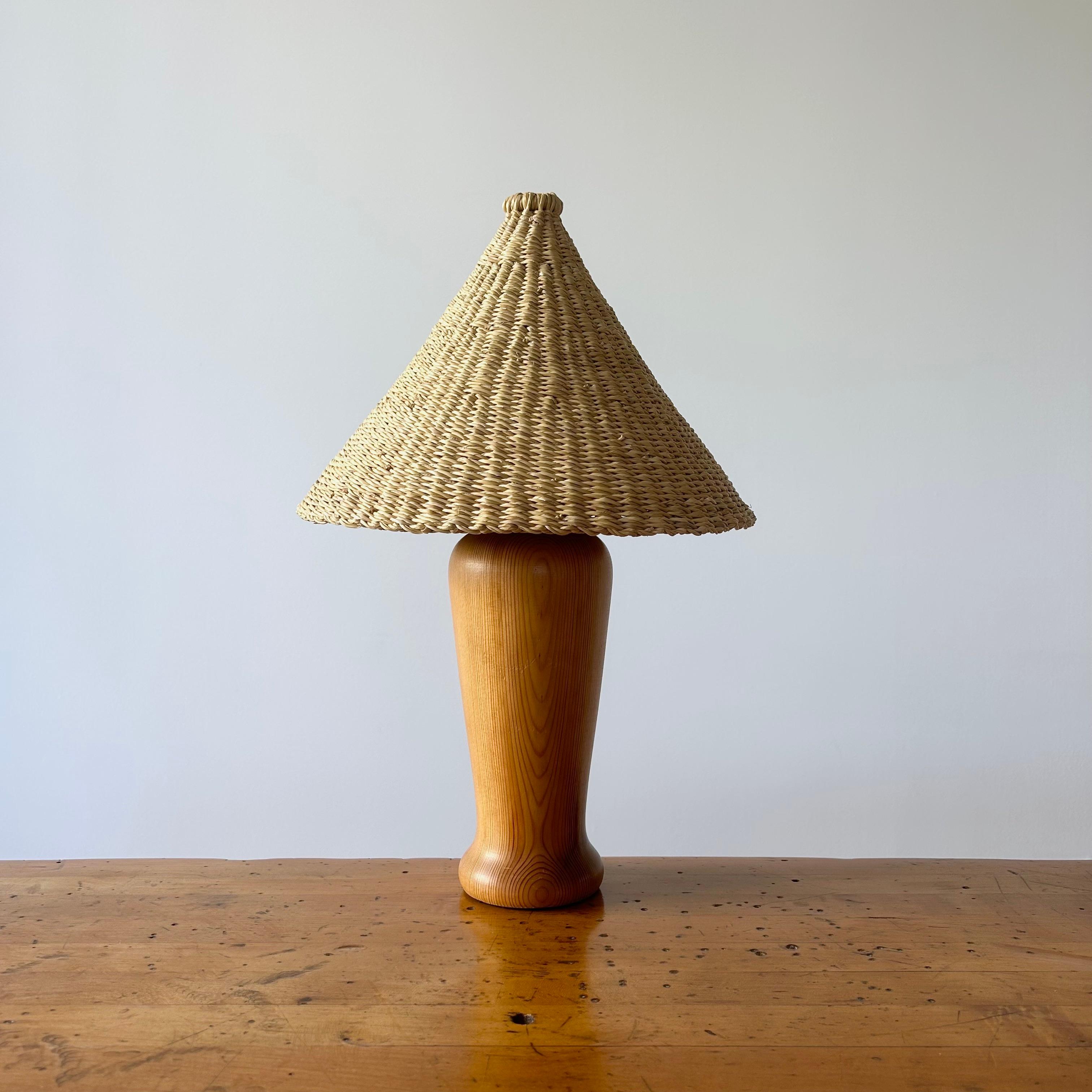 Beautifully proportioned vintage oak table lamp from the Netherlands circa 1980s. Good vintage condition. Rewired in LA and refreshed with our elephant grass shade. One available.

Light shade handwoven by a women's organization for traditional arts