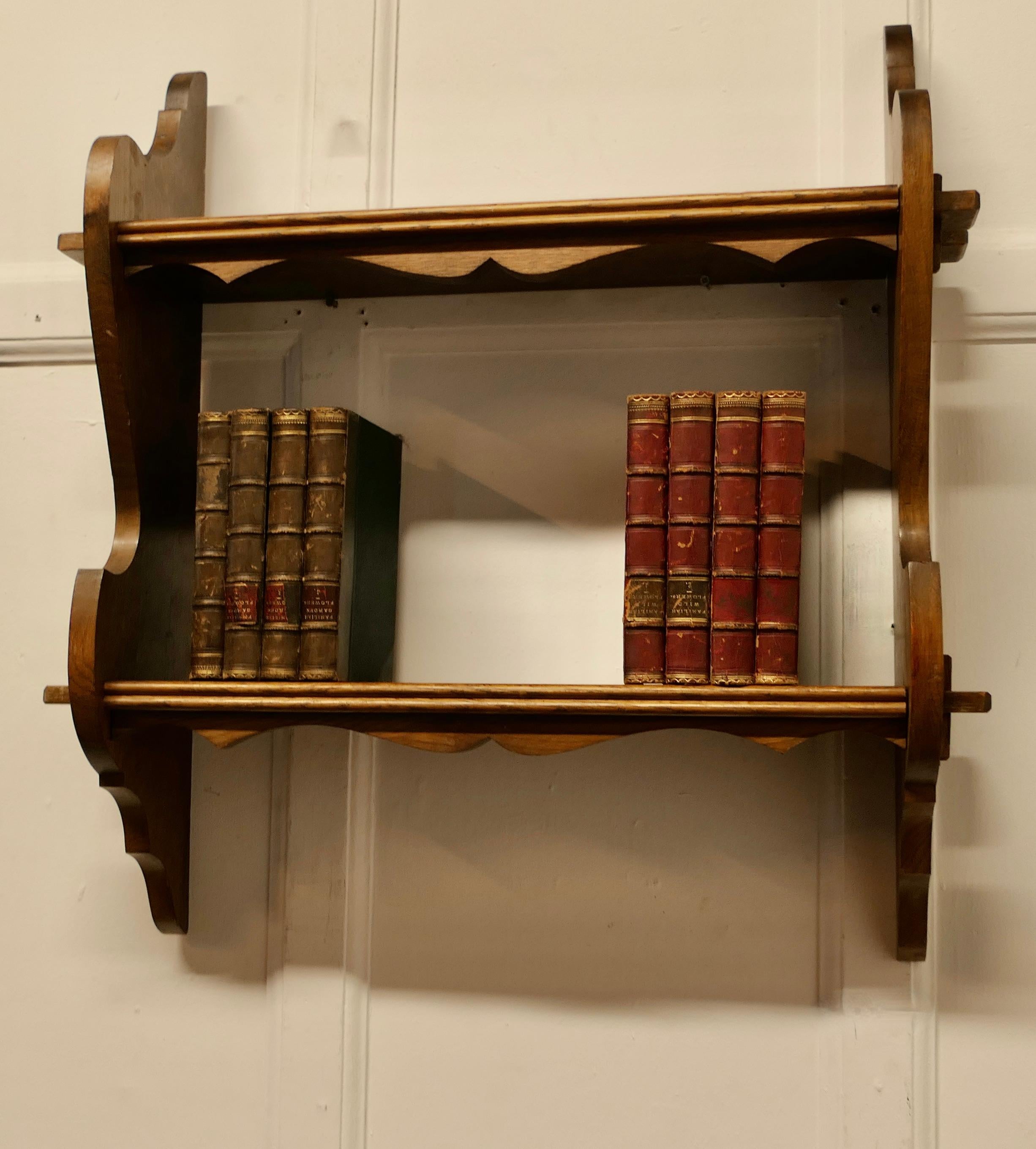 Arts and Crafts Oak Wall Hanging Book Shelf   This charming little shelf unit, has 2 shelves   For Sale