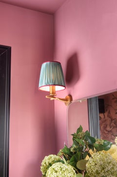 Oak wall light with casting brass structure and fabric lamp shade