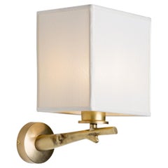 Oak wall light with casting brass structure and fabric lamp shade