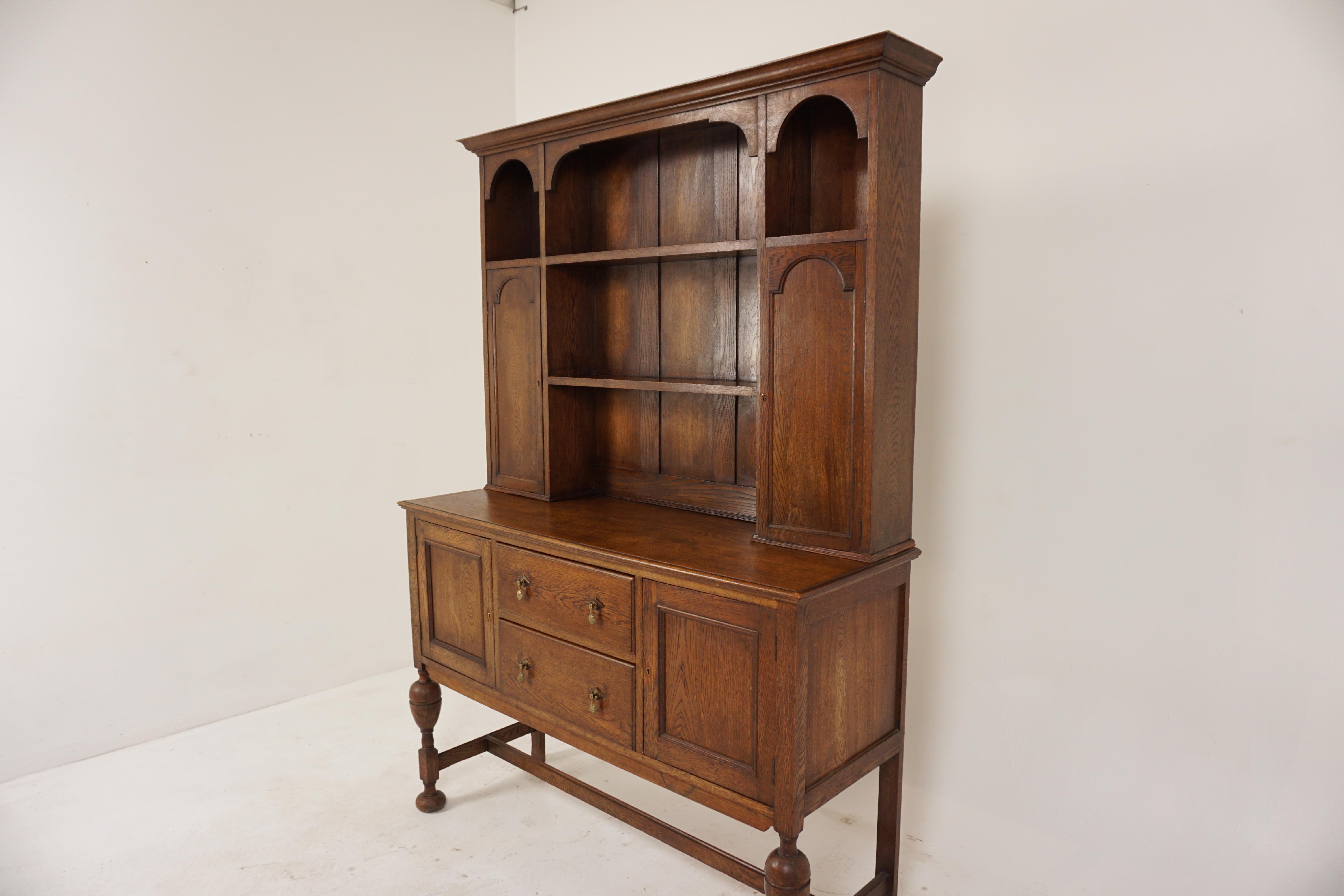 Oak welsh dresser, buffet + hutch, Scotland 1920, B602

Scotland 1920
Solid Oak
Original finish
Overhang Cornice on Top
Four plate rack shelves
Pair of panelled cupboard doors open to reveal single shelf
The base with two dovetailed drawers