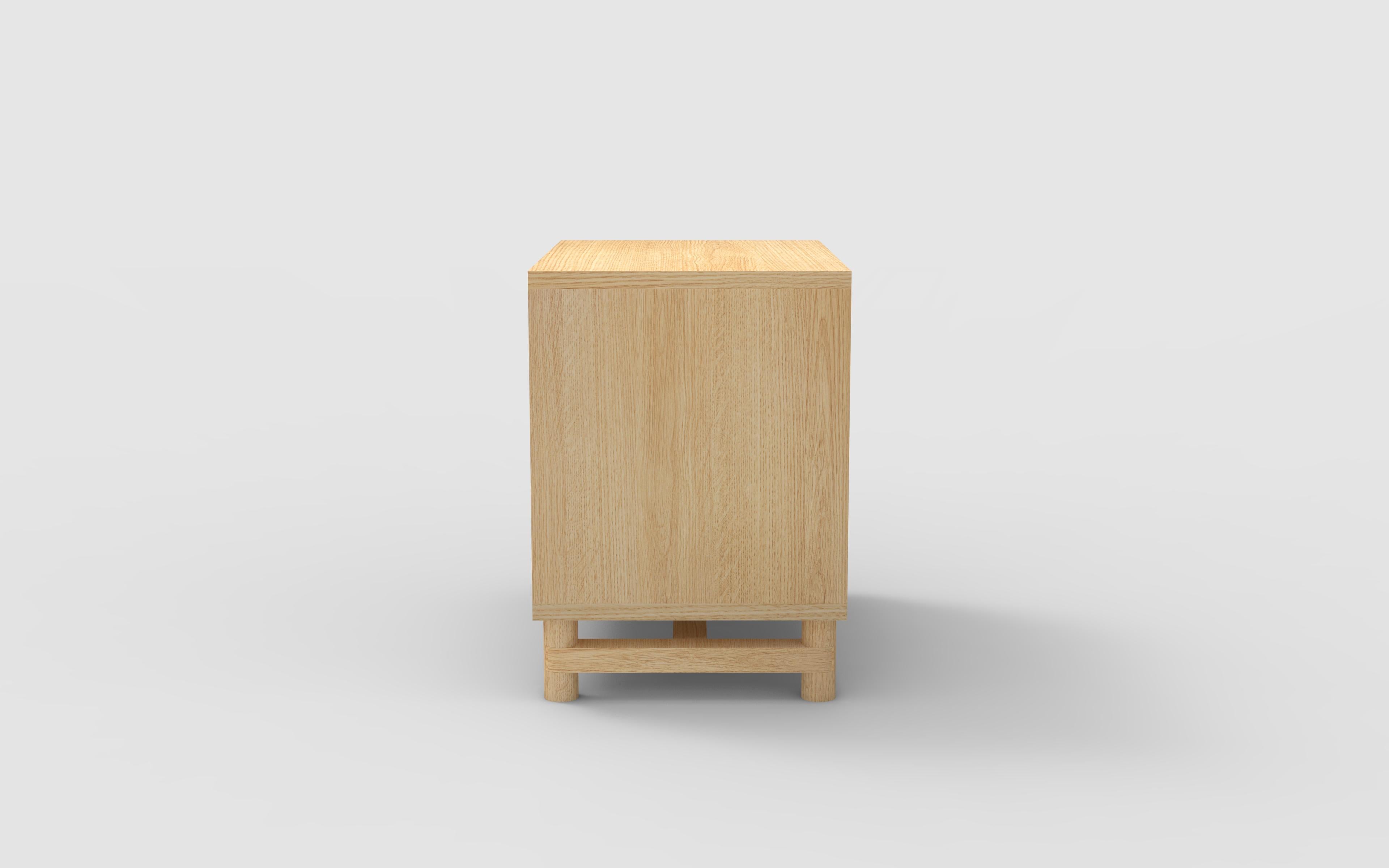 The Tabor bedside table shown in natural beautiful oak and can be made in custom sizes as well as custom wood species and finish. All hand crafted in our shop in Brooklyn, NY. 
This item is only available custom and special order *PRICE IS AN