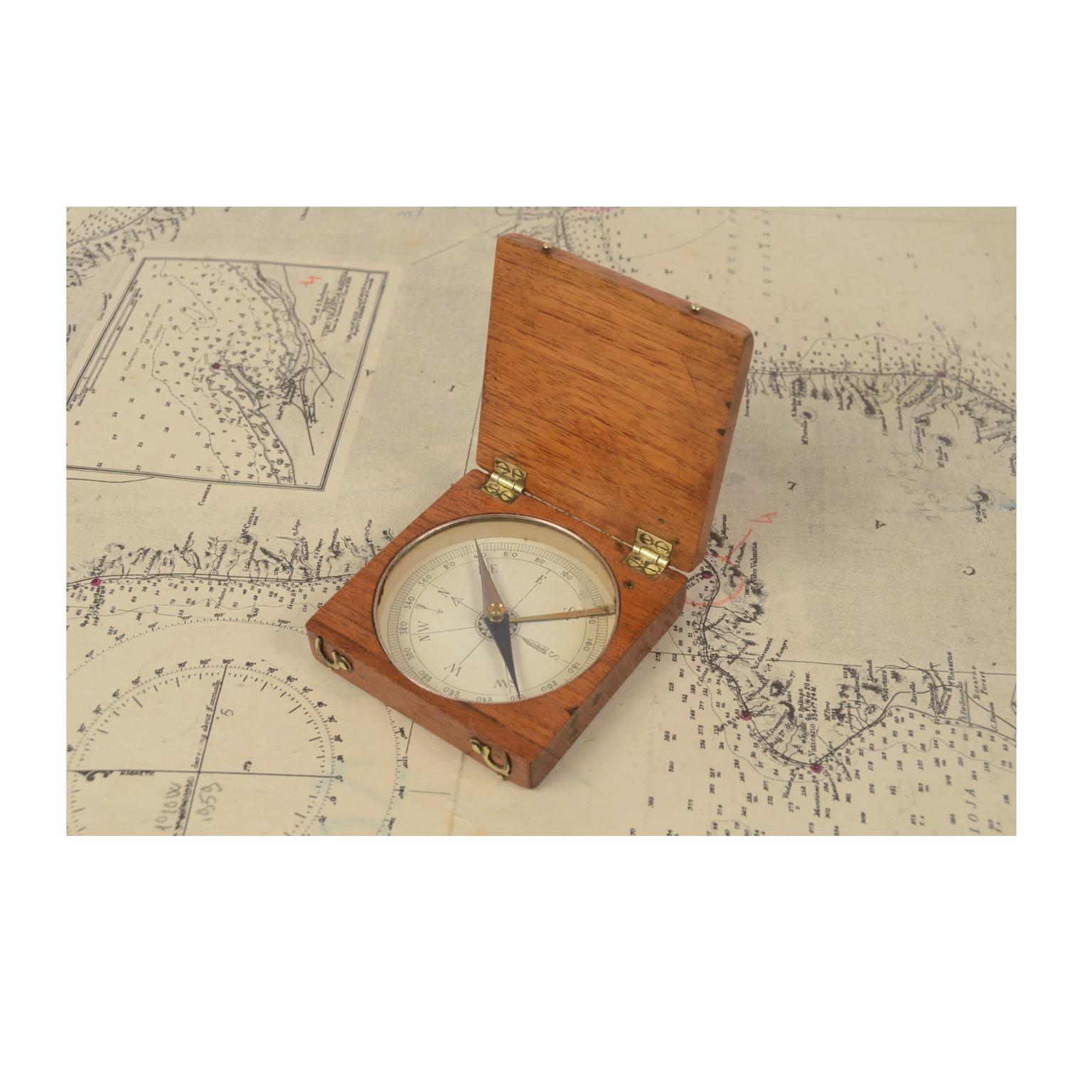 Magnetic surveying compass, oakwood with brass hinges and closing hooks, instrument consisting of a magnetized needle free to rotate on a horizontal plane, marking the direction of magnetic north with the tip of the needle, compass card with eight