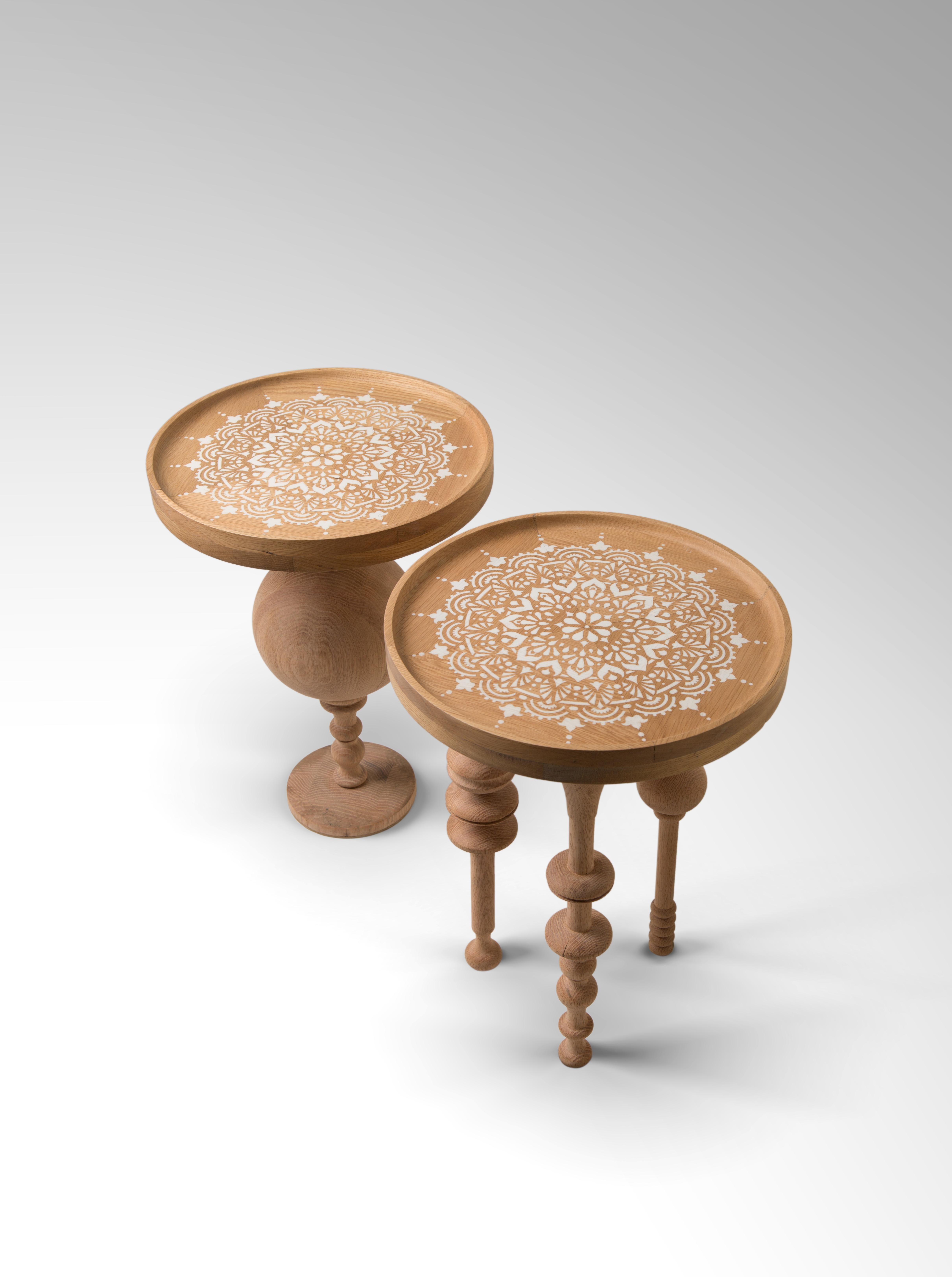 Oak Wood Side Table Set with Arabesque-Inspired Legs & Stenciled Mandala Motif .
A set of classic tables with a contemporary flair, Our Funky Fusion side tables are made of Oak wood with a custom-stenciled Mandala motif. They are both relaxing and