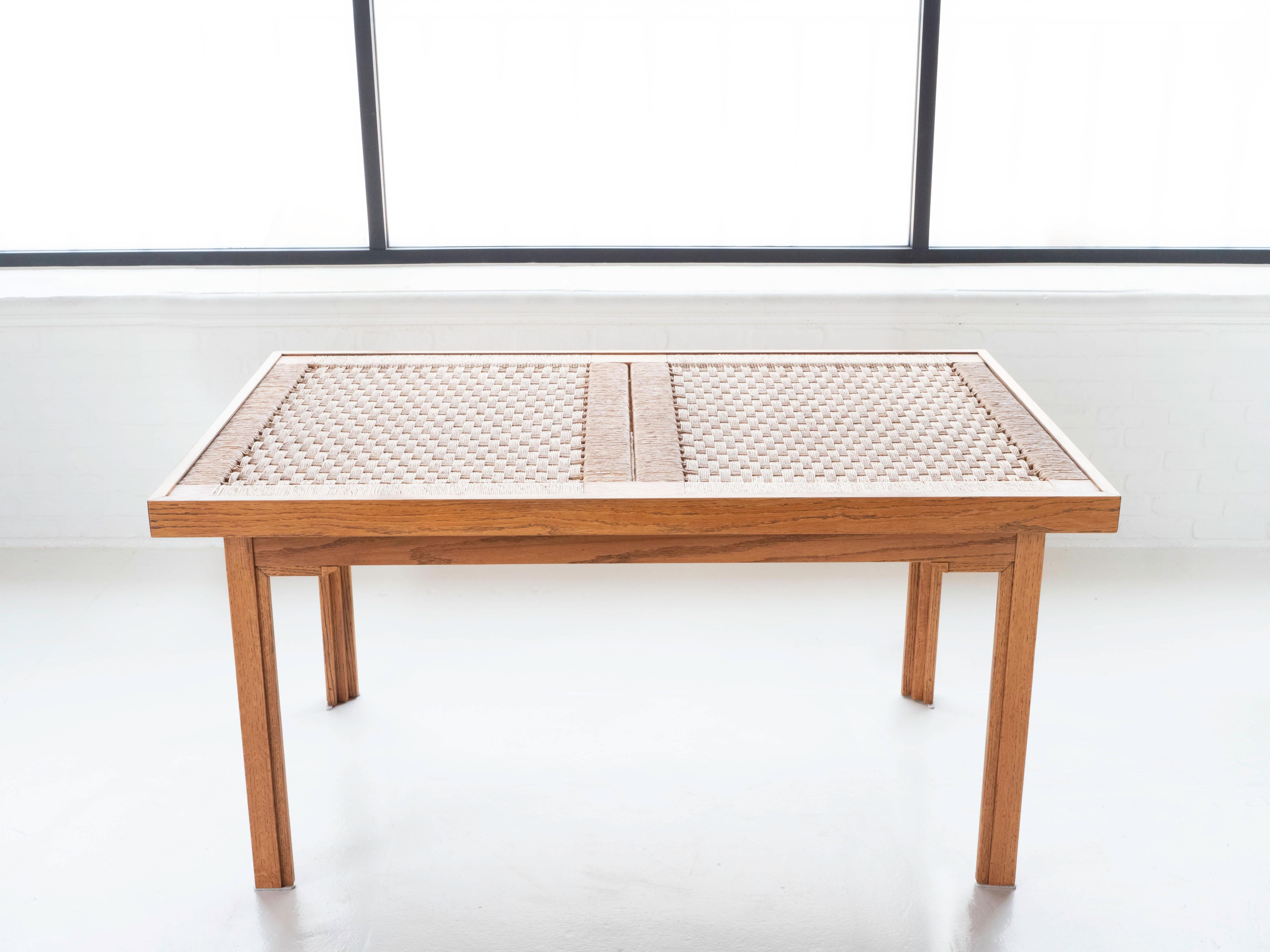 Solid oak base dining table with a woven palm cord top with glass cover.  Purchased by the original owners in the 1950's during a trip to Mexico City.  The design is in the style of Michael Van Beuren and Clara Porset.

The table has been lightly