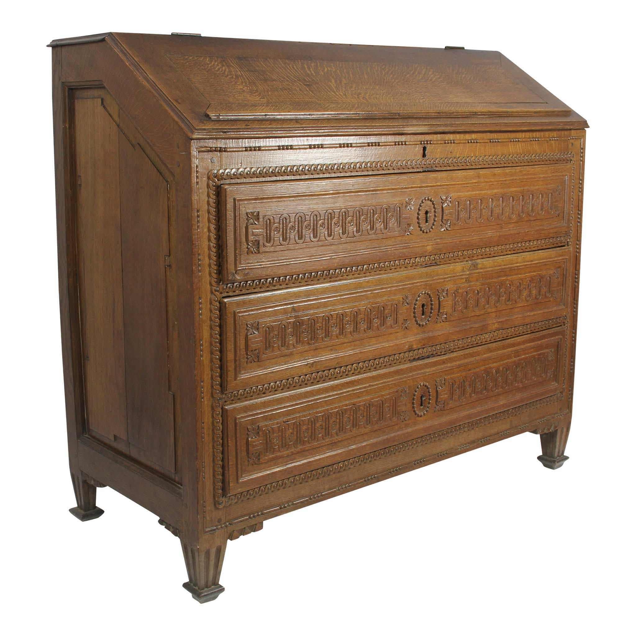 Made of solid oak and finished with a light stain, this beautiful writing desk has a narrow depth that maximizes storage without sacrificing floor space. Unlike many writing desks, the slanted, top face of this desk folds up rather than down. This