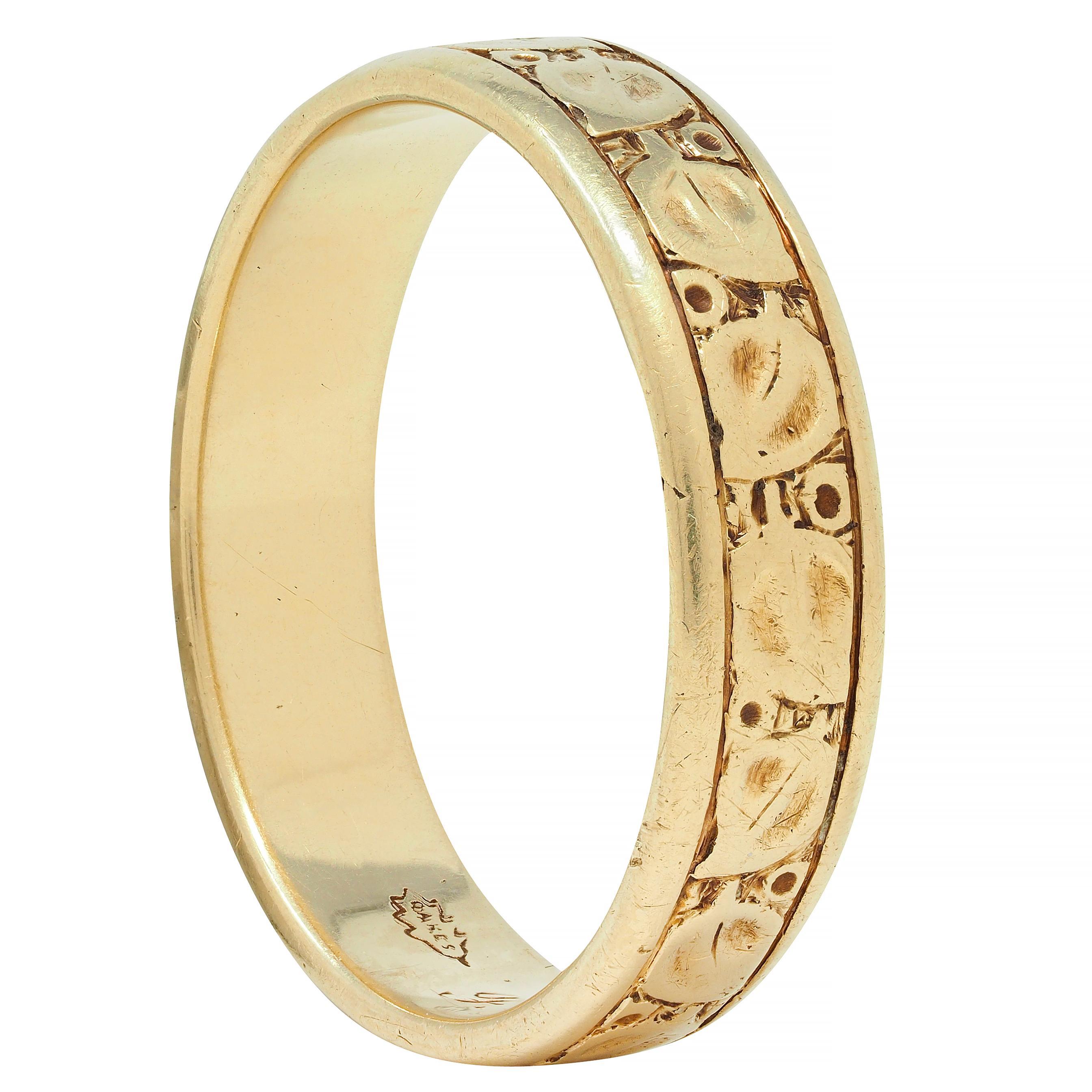 Designed as a gold band with rounded edges and an engraved foliate motif
Featuring meandering leaves and spots 
With grooved edges
Inscribed 'F.E.M and E.F.H 1896-1946' 
Tested as 14 karat gold
With maker's mark for E.E. Oakes 
Circa: 1946; via