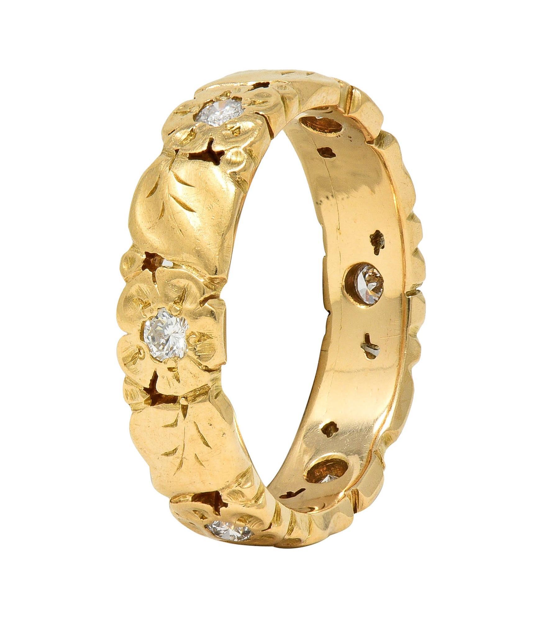 Designed as a pierced pattern of flower blossoms and leaves fully around
Grooved with engraved foliate and petal details 
Featuring single cut diamonds flush set around 
Weighing approximately 0.18 carat total 
Eye clean and bright 
Stamped for 14