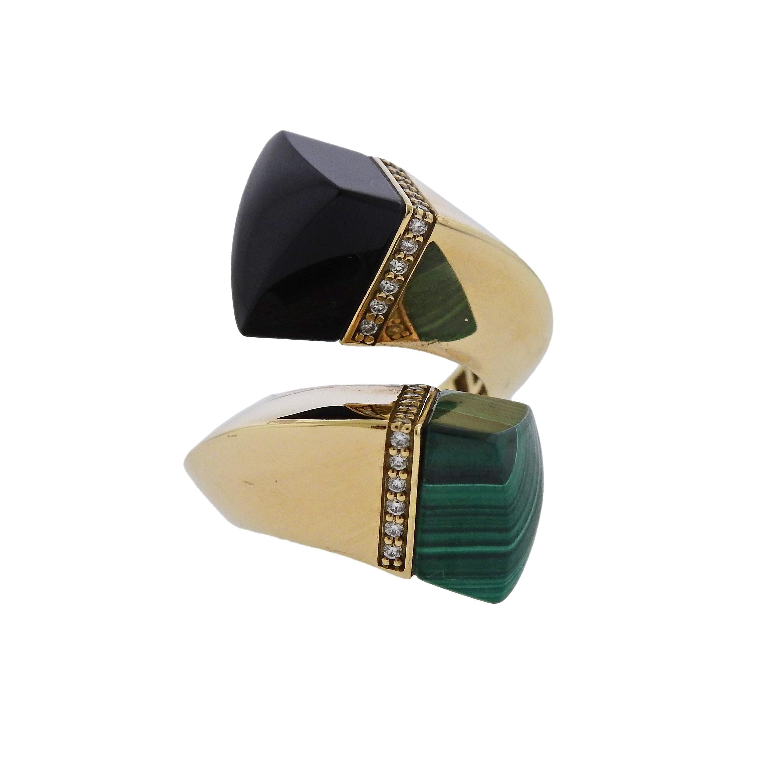 18k yellow gold bypass ring by Oakgem, featuring approx. 0.19ctw in G/VS diamonds, onyx and malachite. Ring size - 6.5, ring top is 29mm wide, weighs 12.7 grams. Marked 18k. 