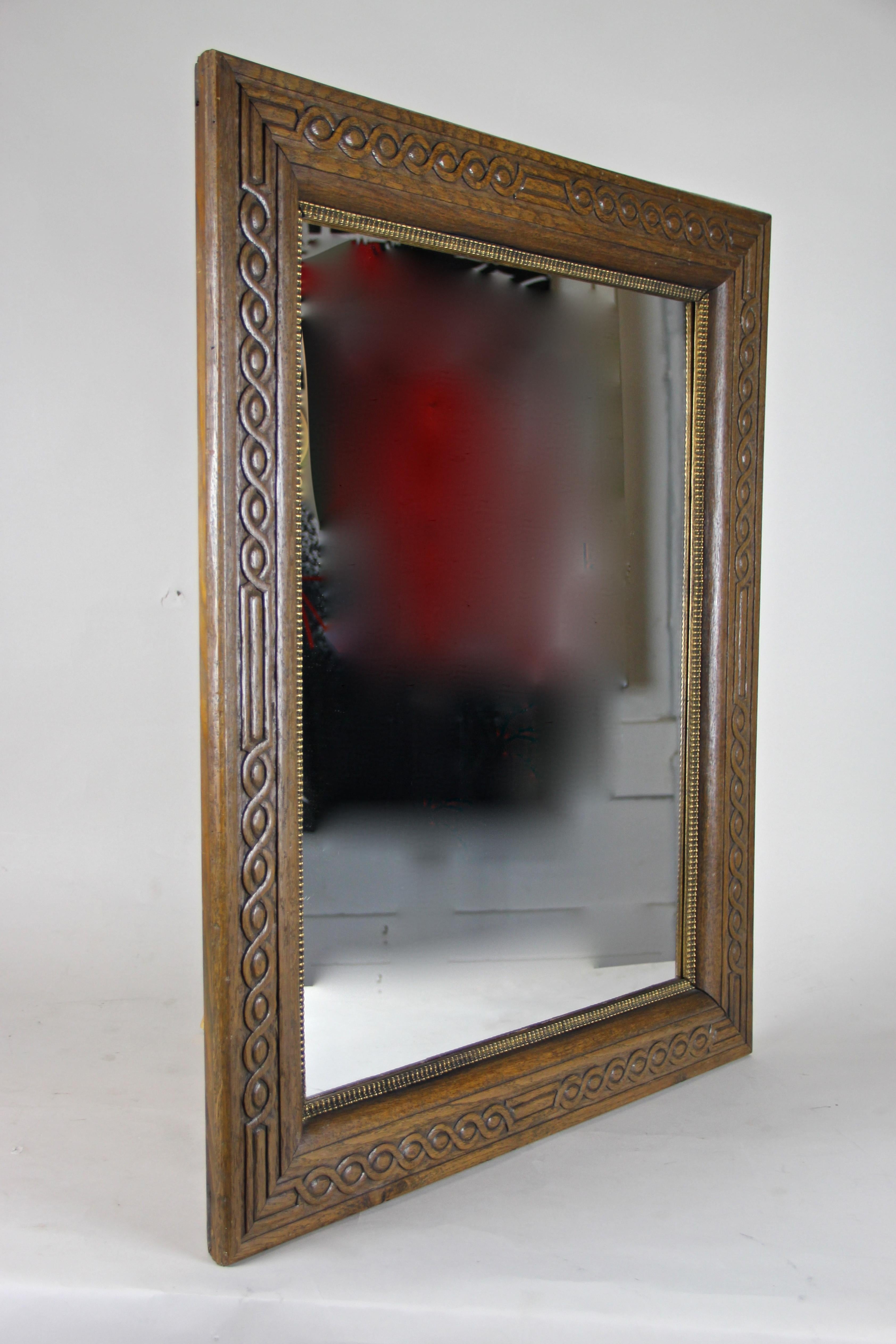 From the Historism period in an Austria circa 1890 comes this fantastic oakwood wall mirror. Made around the turn of the century this late 19th century wall mirror comes with a spruce wood overlapped inserted substructure and impresses with a nice