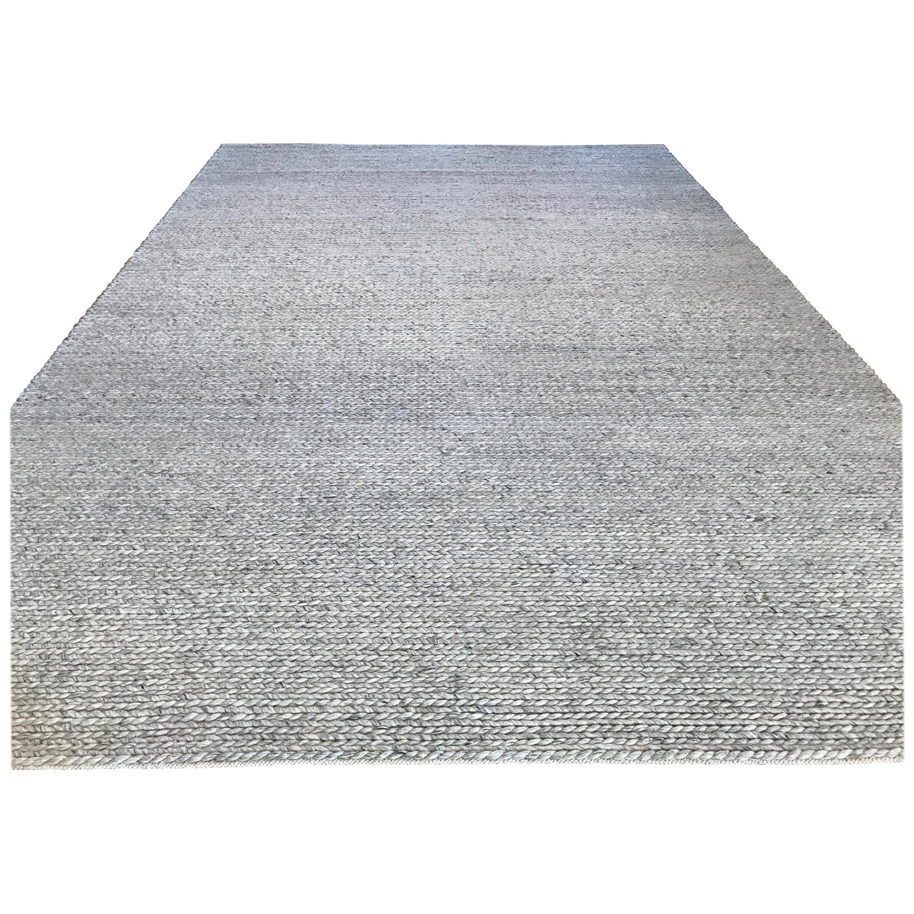 A thick and generous wool braid provides comfort underfoot and durability for high traffic areas. The neutral oatmeal coloring with subtle variations makes for a versatile piece, matching well with a wide range of colors and finishes. Hand knotted