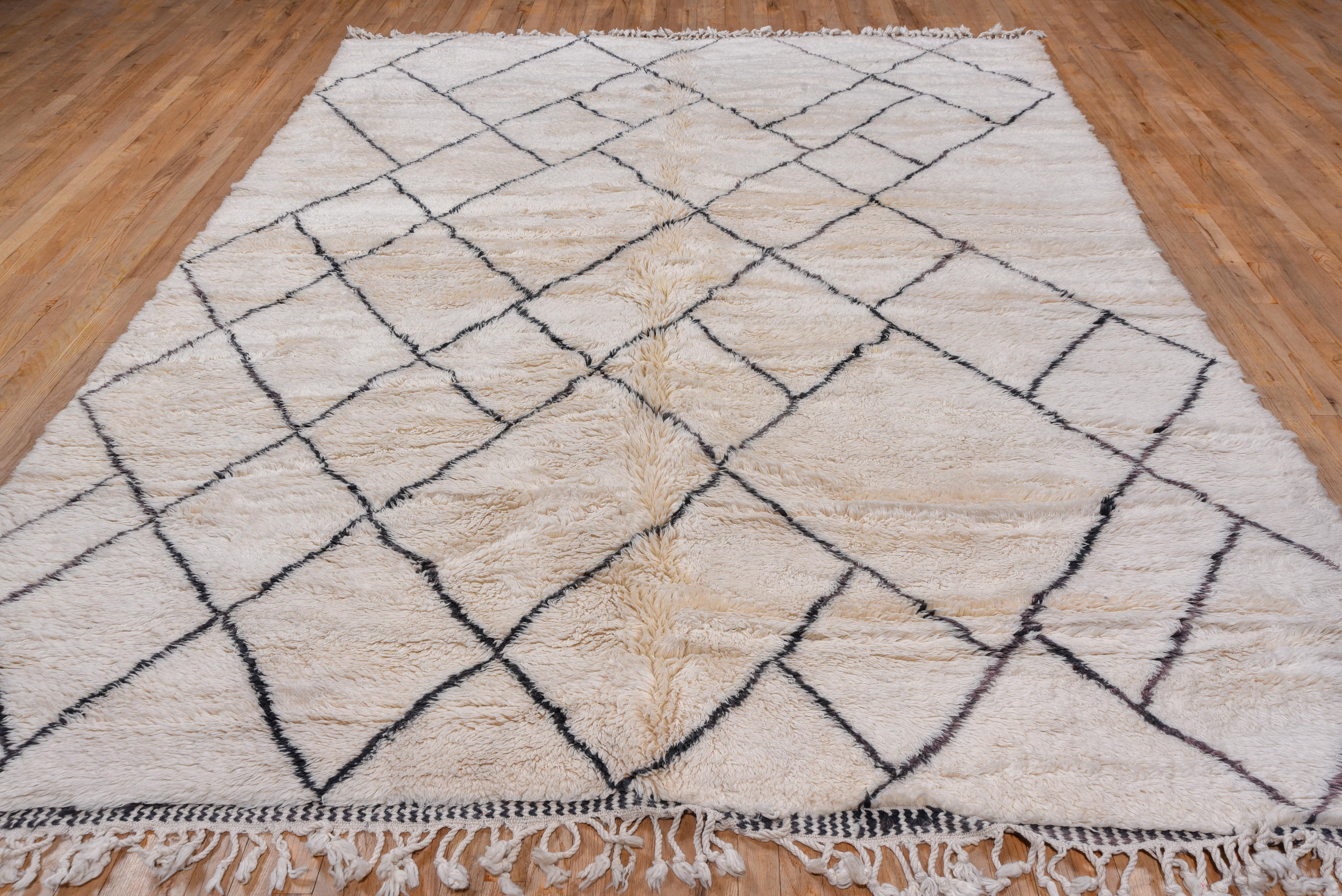 This Moroccan hand knotted shaggy rug is perfect for folks who love something cozy under foot with a neutral textural vibe. These rugs have a modern twist on a traditional technique and can be used in any soft of room or environment, especially