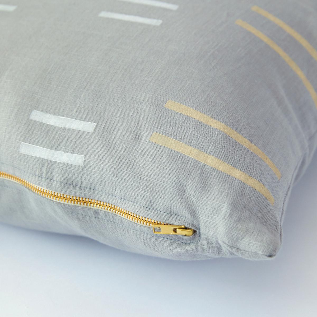 This pillow features Oaxaca by Caroline Z Hurleywith a knife edge finish. Designed by Caroline Z Hurley in her Brooklyn studio and block-printed in New Bedford, Massachusetts. Each shape is cut and individually stamped onto the linen by hand. Pillow