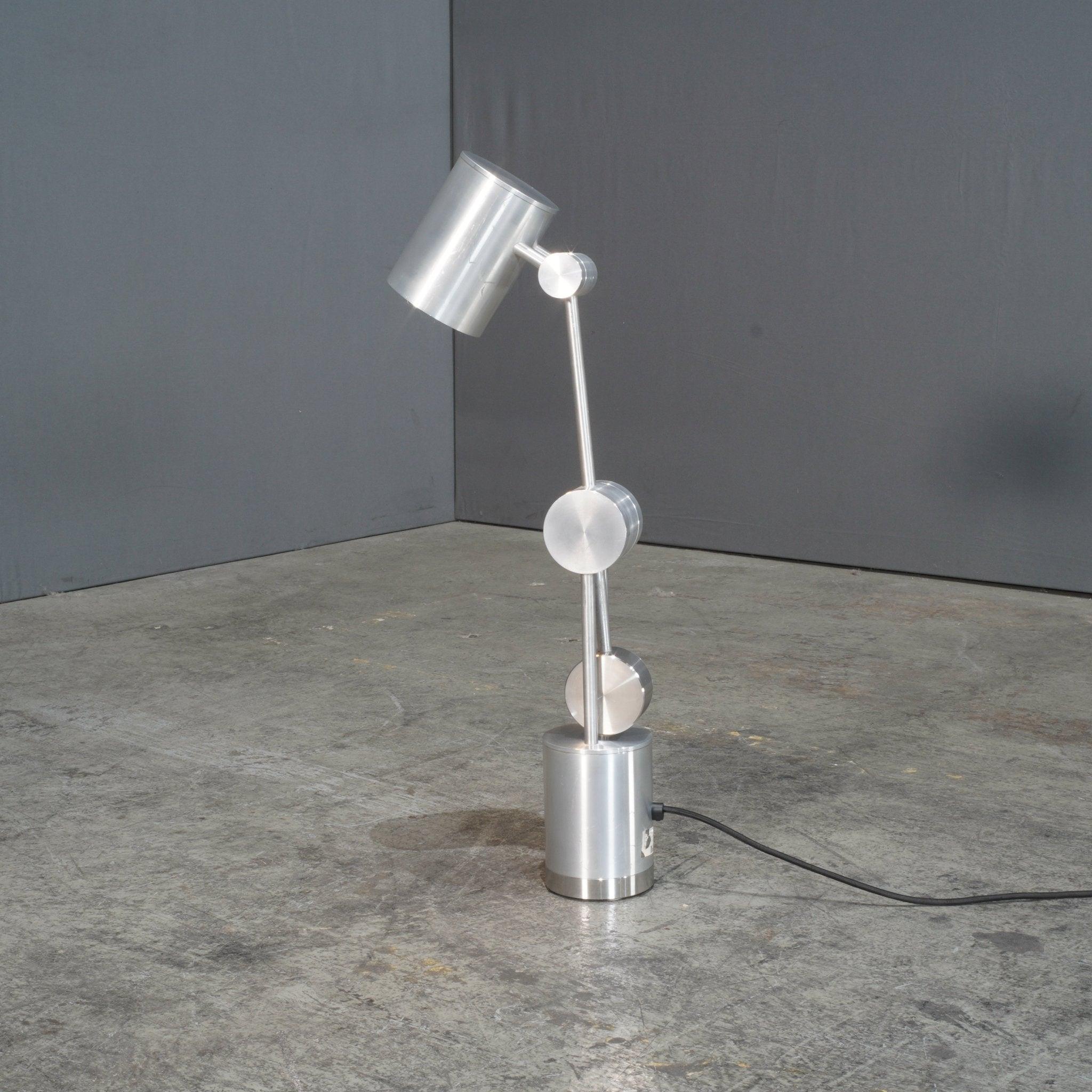 The Camden desk lamp by Tom Dixon, crafted in 2018, is a perfect blend of modern design and functionality. Its sleek metal construction and contemporary style make it ideal for any workspace. Perfect for adding a touch of elegance to your desk.
