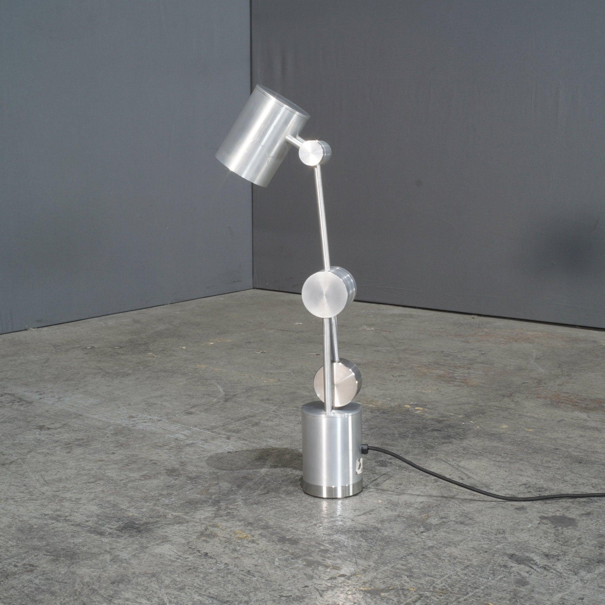 The Camden desk lamp by Tom Dixon, crafted in 2018, is a perfect blend of modern design and functionality. Its sleek metal construction and contemporary style make it ideal for any workspace. Perfect for adding a touch of elegance to your desk.
