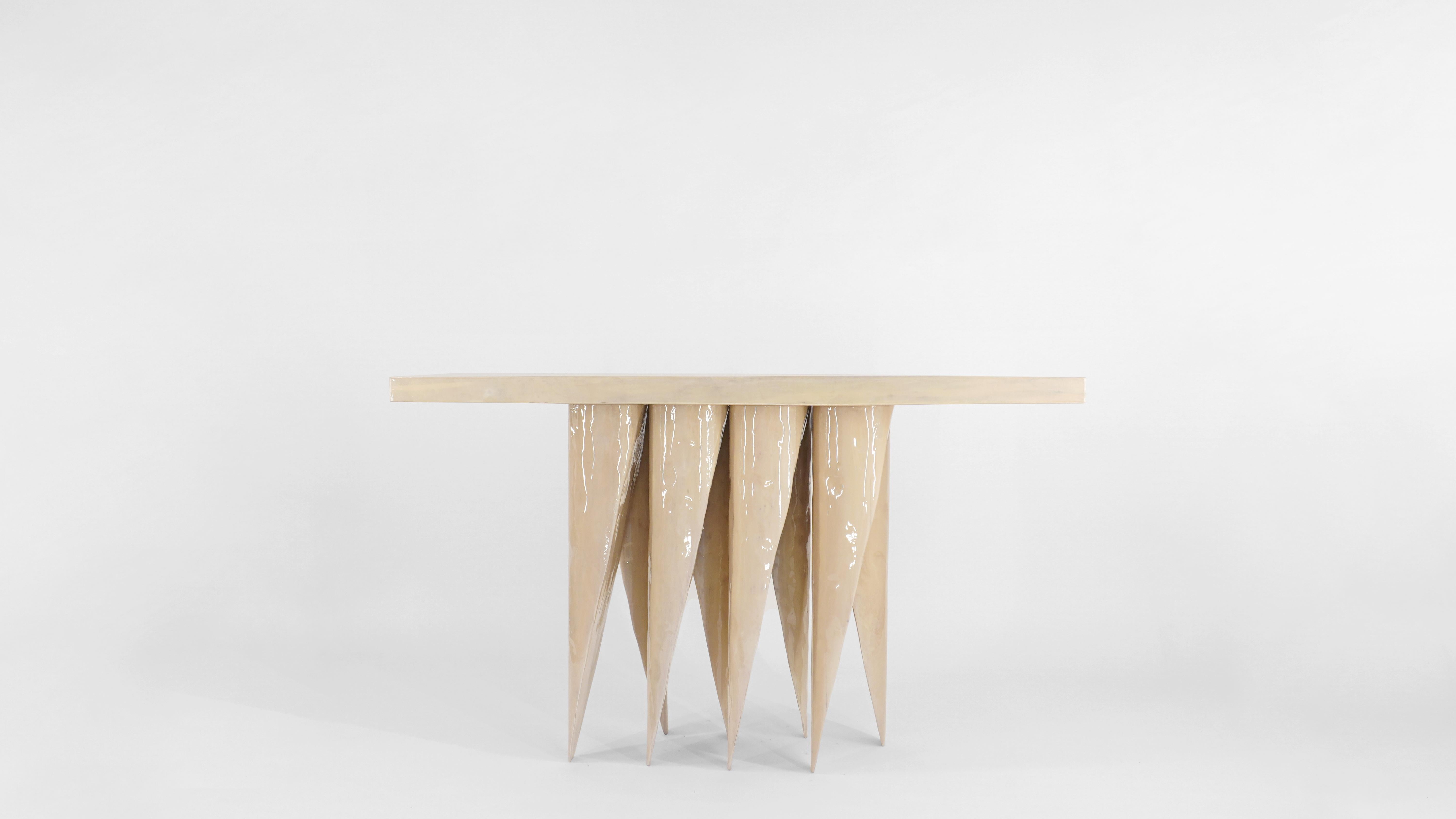 Obeisance Console Table by Henry D'ath
Dimensions: D 150 x W 45 x H 85 cm
Materials: Wood.

Piece is handmade by artist.

Like its smaller counterpart, the Obeisance console table rests on eight overlapping legs. From most angles the table appears