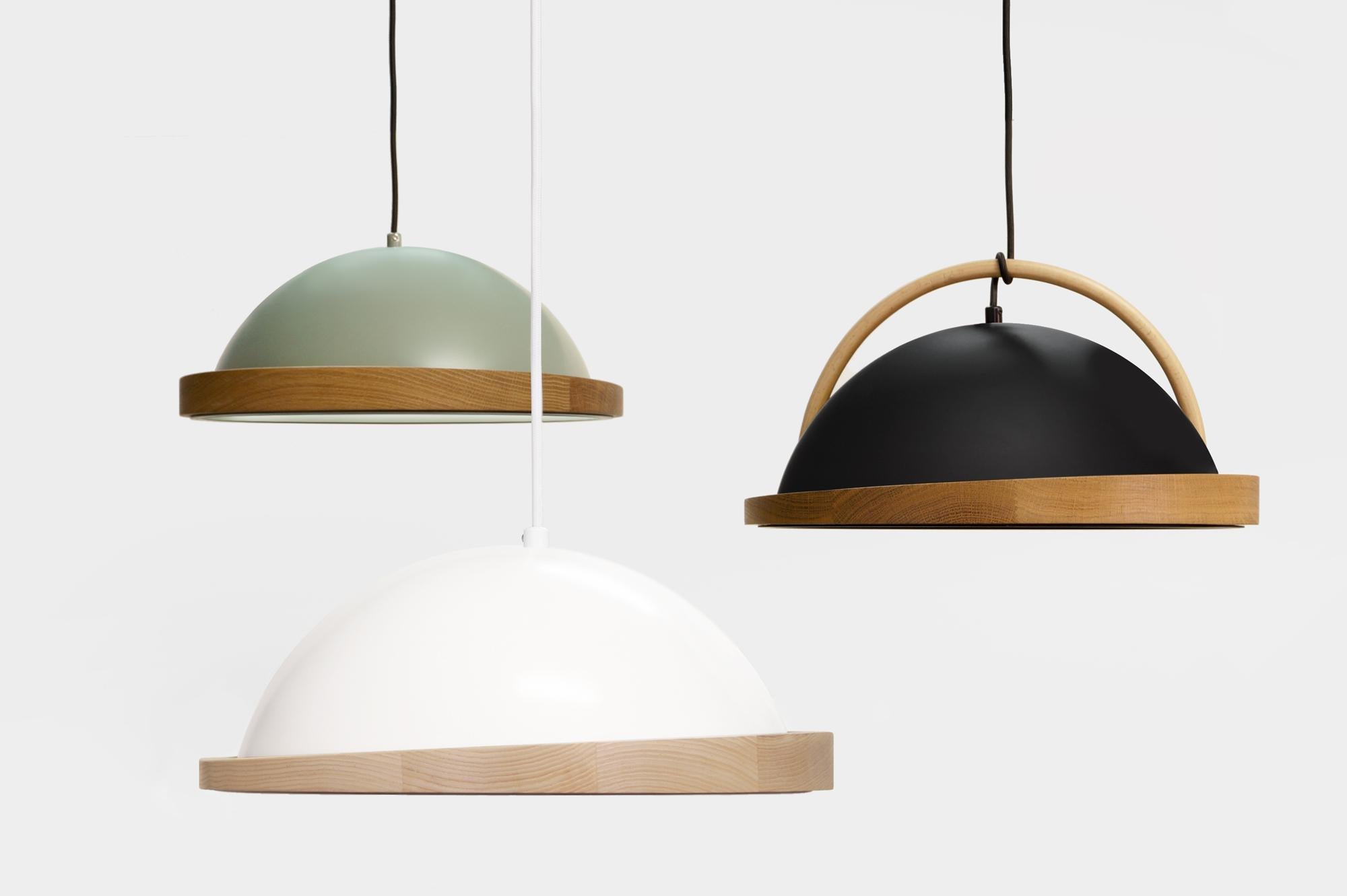 Obelia pendant lights are a collection of local artisan made spun aluminium lights with angled natural solid timber rims as their feature. With the additional bent timber arc and timber dowel, Obelia will hang cozily in all environments.

The