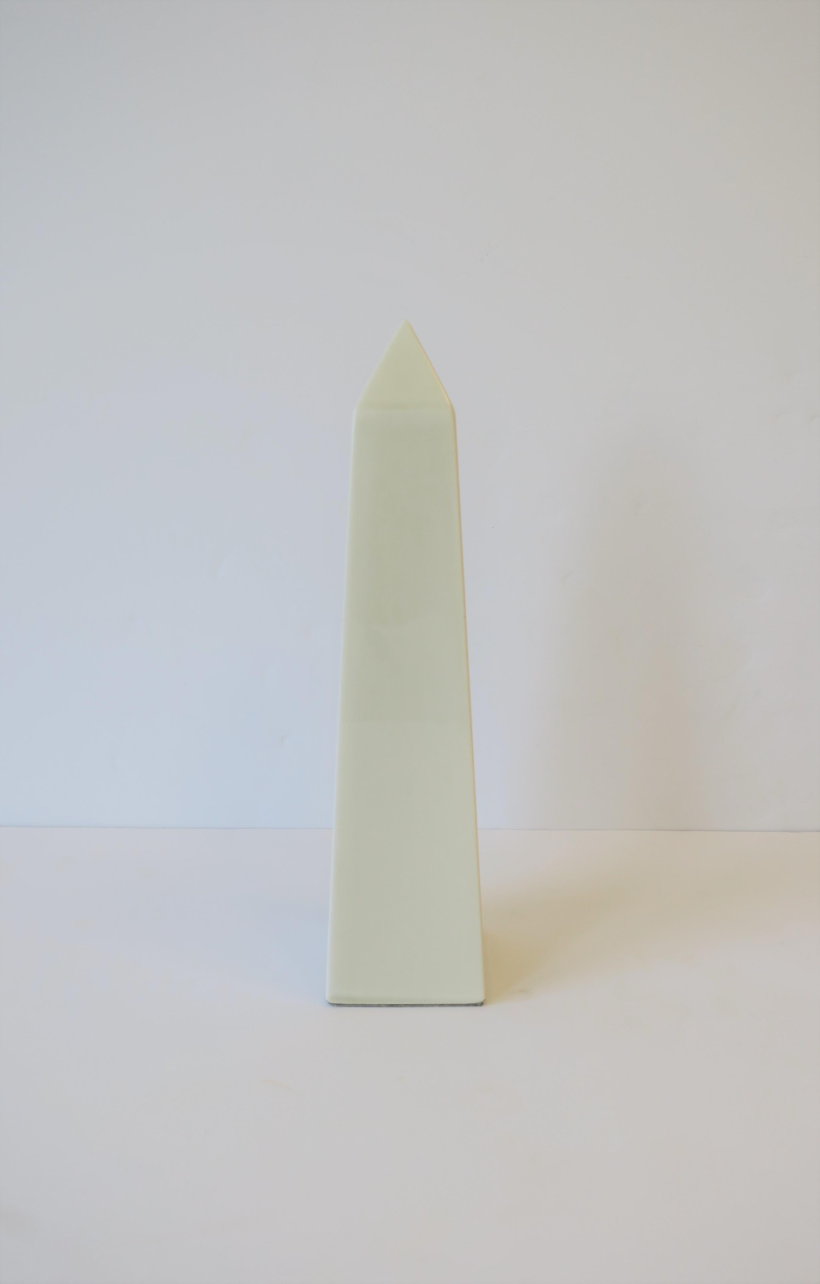 A beautiful ceramic obelisk in a 'stone' hue/color measuring 11.5 inches high, from Fritz & Floyd. Excellent condition. 

Measurements: 2.63 inches square x 11.5 in. H.
 