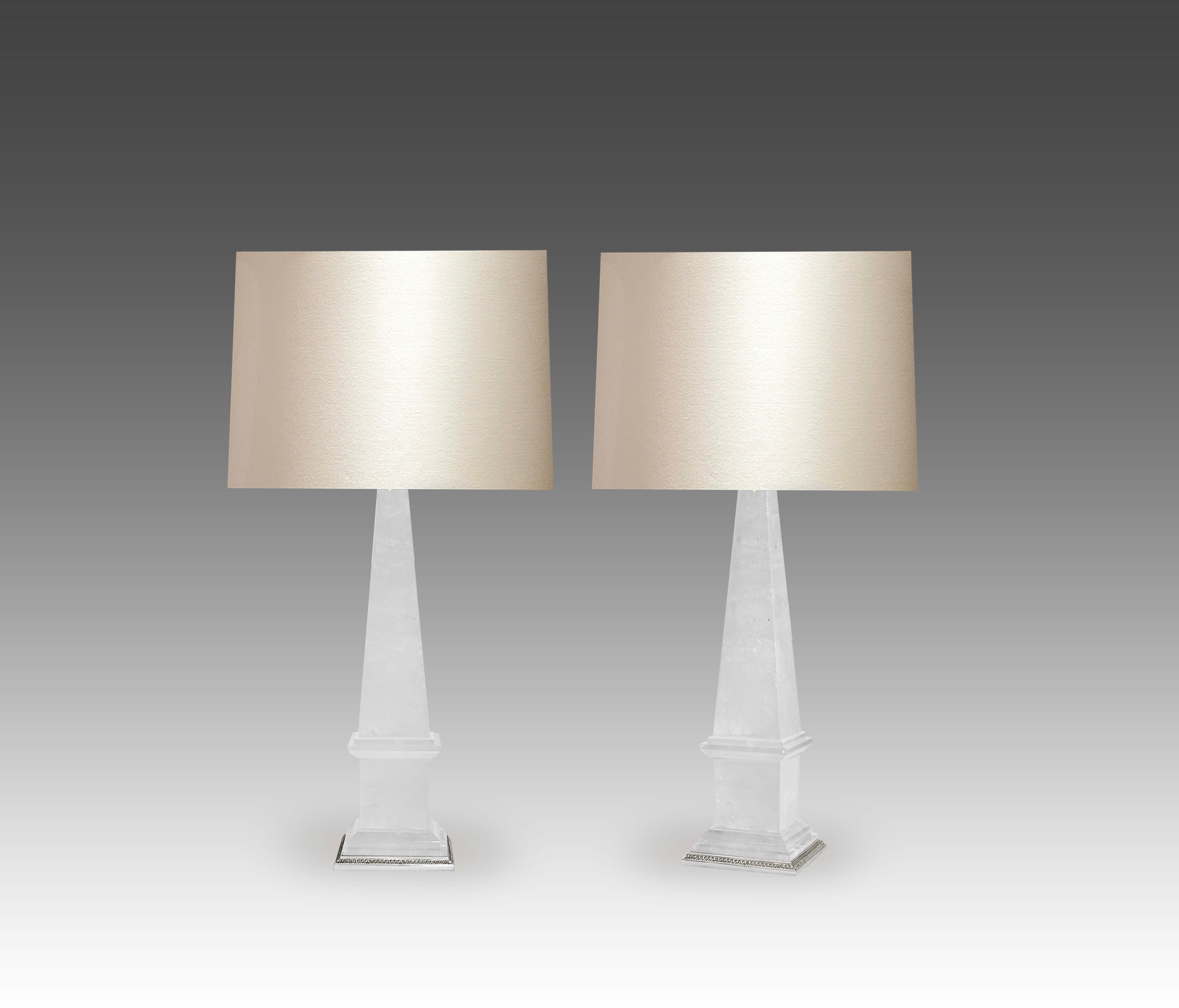 A pair of obelisk rock crystal lamps with fine castled polished nickel bases. Created by Phoenix Gallery.
Each lamp installs two sockets.
To the top of the rock crystal: 17