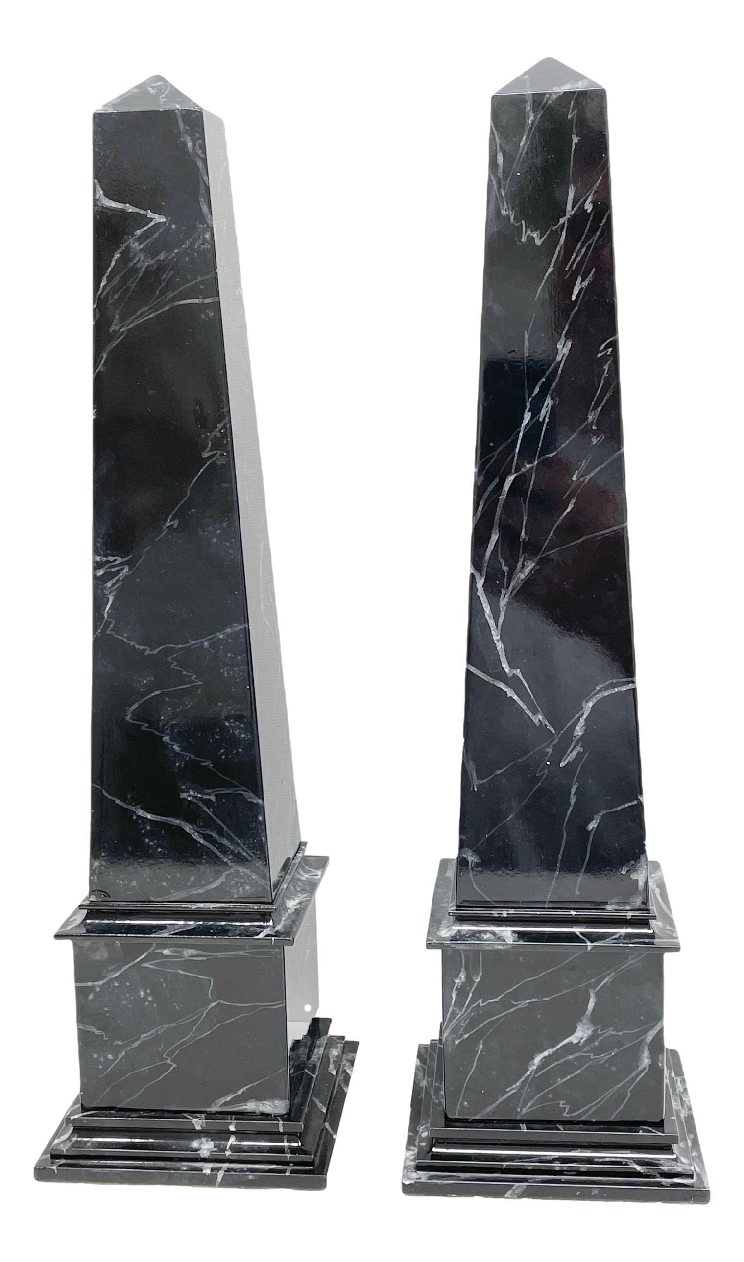 This beautiful pair of 1900s Austrian obelisk will make a definite statement with their classic form and use of black and white marble finish. Handcrafted from wood with a lacquered marble finish. A nice addition to any room. Rare and hard to find.