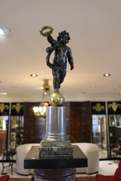 Obelisk with Cherub Holding Wreath