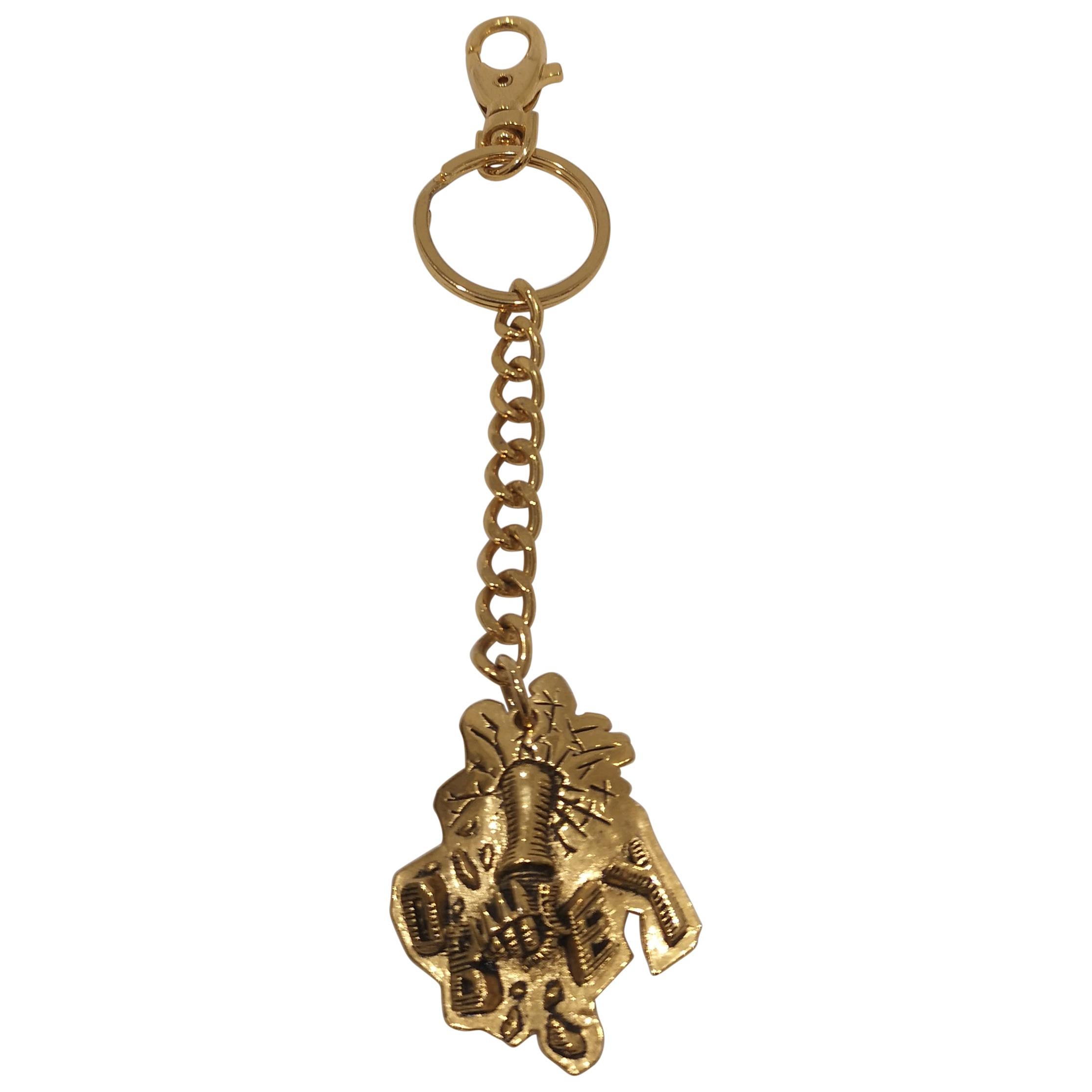 Obey gold tone key chain / accessories